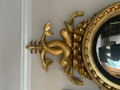 Period regency gilt wood convex mirror with dolphins