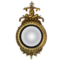 Period regency gilt wood convex mirror with dolphins