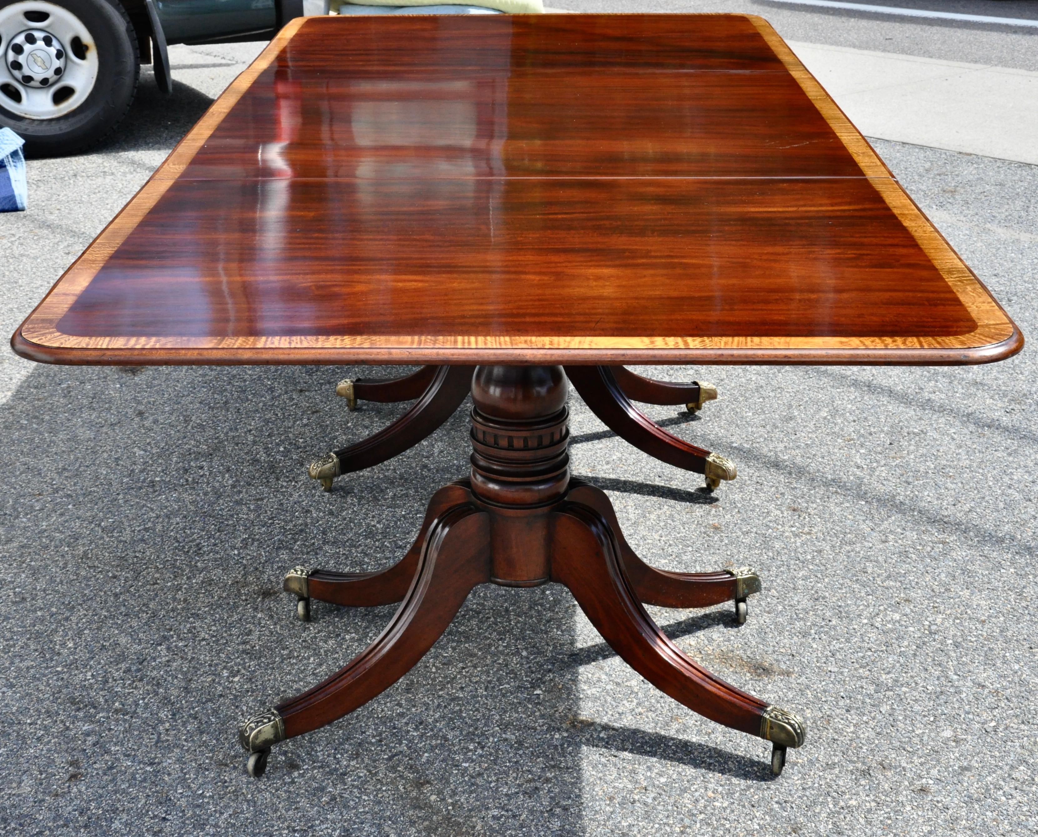 Period Regency or William IV mahogany three pedestal dining table with satinwood banding.

Three pedestal bases with spayed legs. Two original leaves. French polish. Beautiful wood figuring and color

Measures: Fully extended at 163