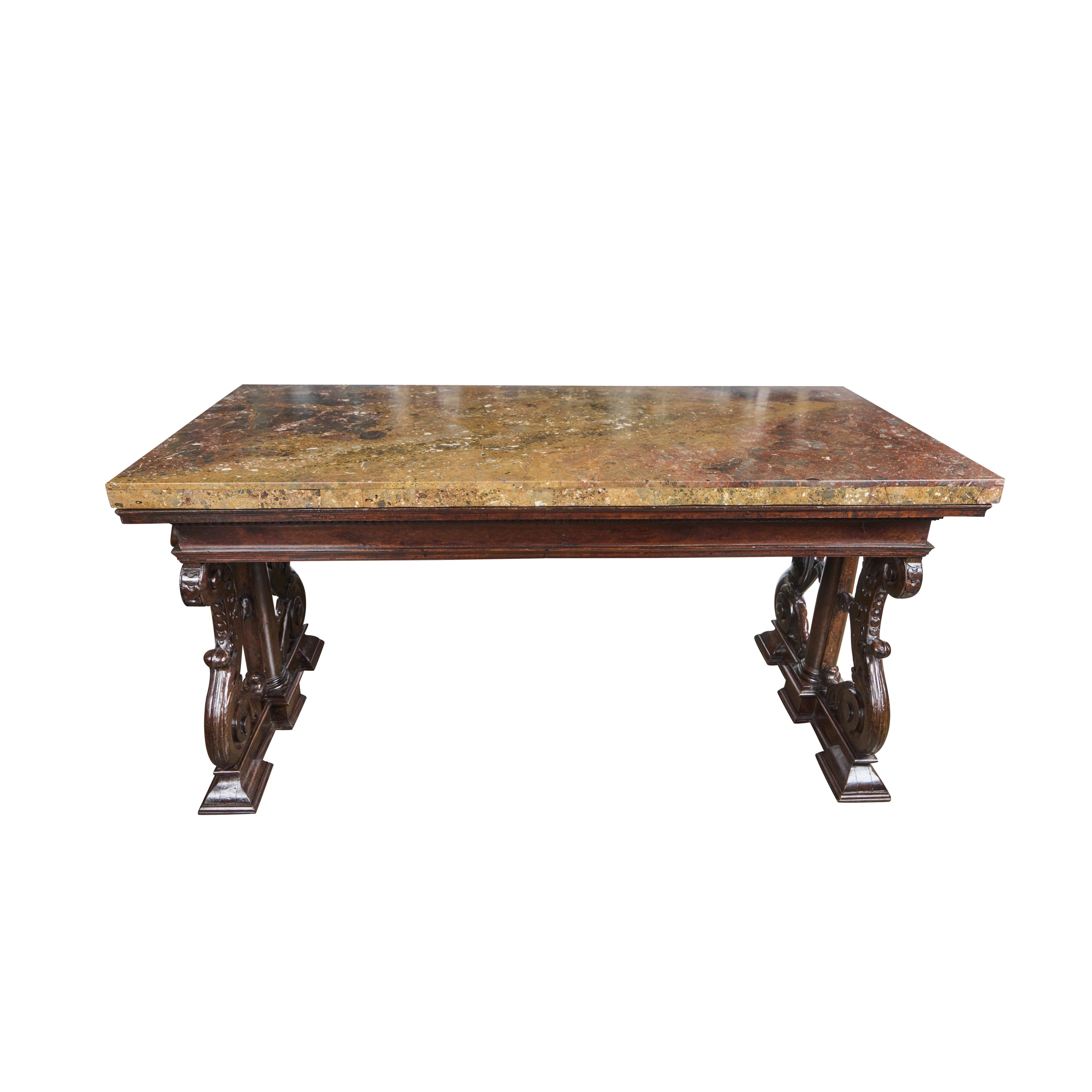 A spectacular, period Renaissance, hand carved, walnut table base with original Breccia Africano marble top.  