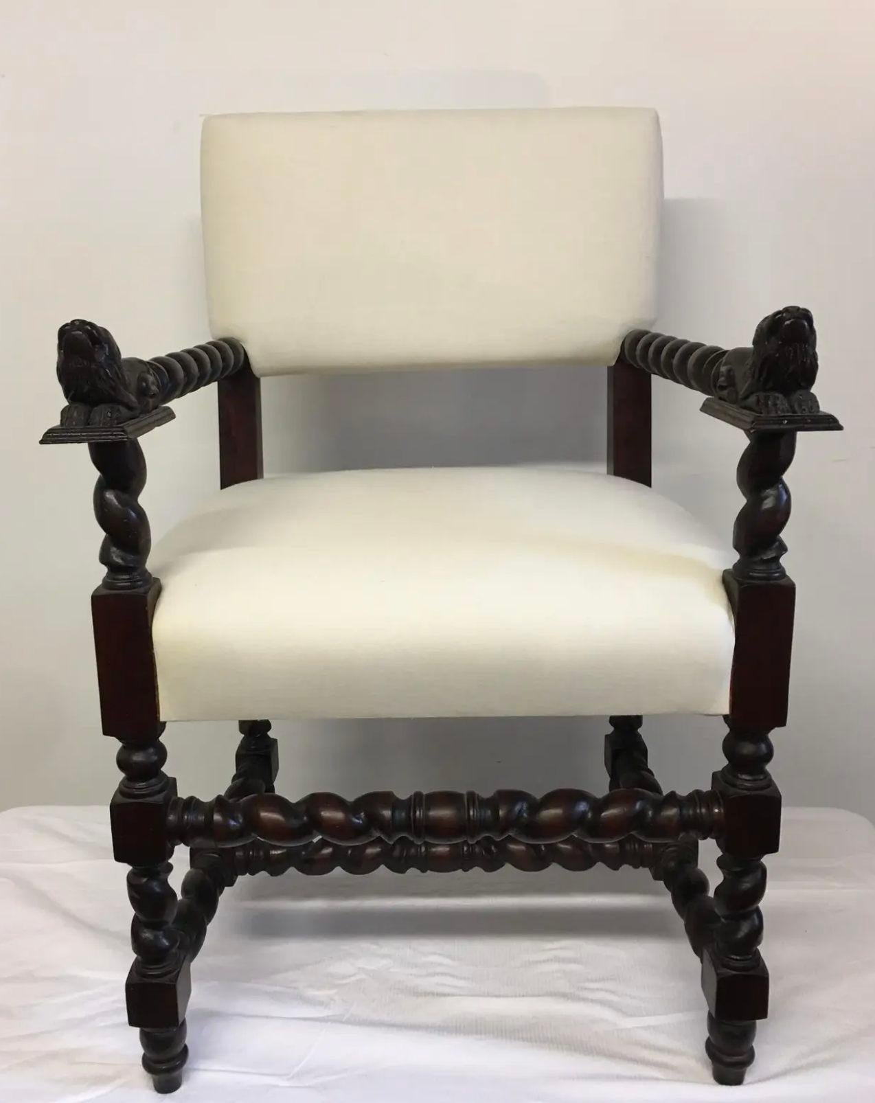 Beautiful antique style English chair with barley twist in cherry wood and polished dark patinated finish. 
Great carving throughout with seated lions at the arms. Chairs custom made and hand carved. Solid cherry wood. New white muslin upholstery.