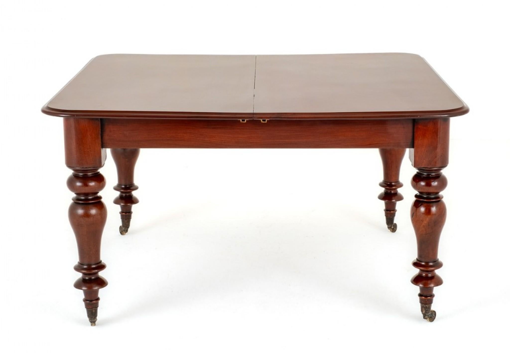 Victorian Mahogany 2 Leaf Extending Dining Table.
This Table is Raised Upon Ring Turned Legs with Original Brass Castors.
Circa 1860
The Table Extends By way of a Pullout Telescopic Action to Accept up to 2 Extra Leaves.
The Top of the Table Having