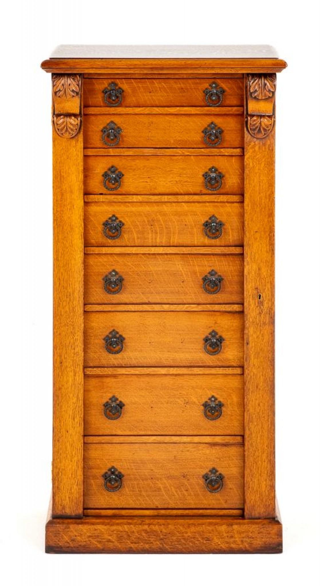 This Wellington Chest is Raised upon a Plinth Base.
Having an Arrangement of 8 Oak Lined Drawers.
Featuring Carved Corbels.
This Chest Has a Typical Wellington Locking System.
Historical Significance: The name 