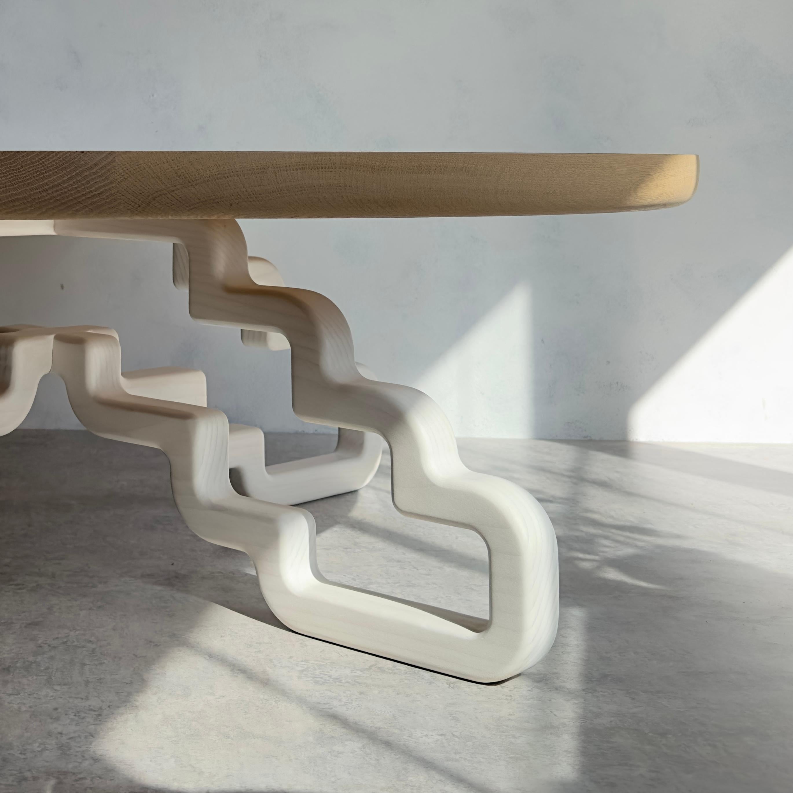 Our Periphery series follows the outer line of our design. The maple weaves and turns, creating unique forms in the negative space. Our Periphery table bases are designed to utilize as much lumber as possible. Producing two base designs in one