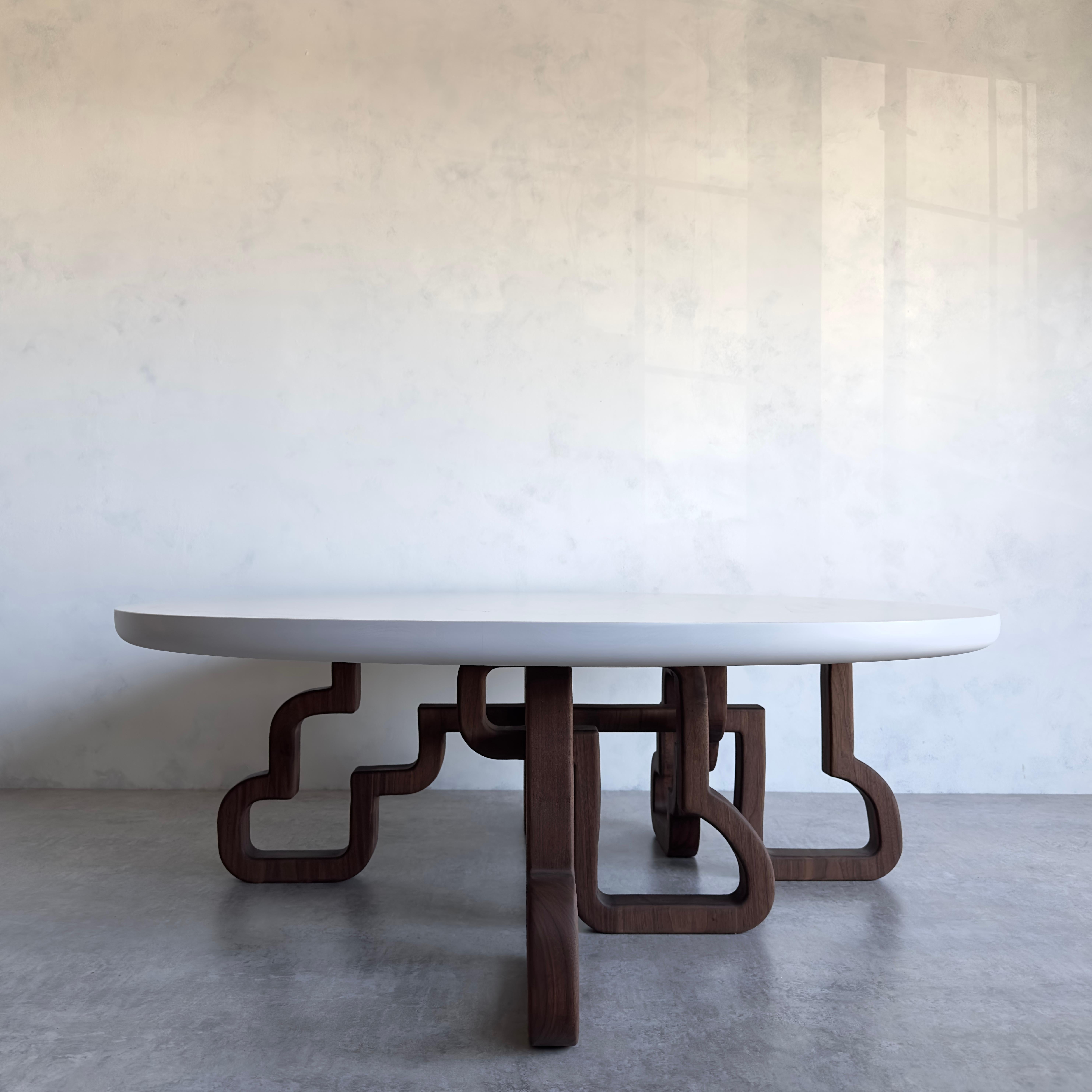 Our Periphery series follows the outline of our designs to create a second table base that utilizes the negative space left by the inner design. The walnut weaves and turns, creating unique forms in the negative space. As this design mimics the
