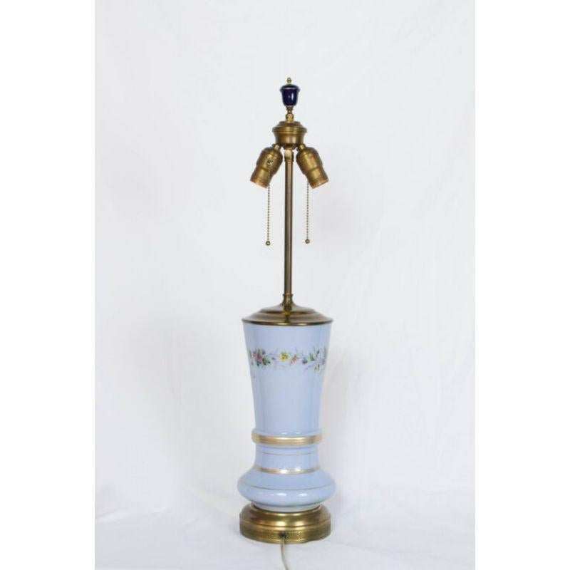 Periwinkle Bristol Table Lamp. Blue opaline glass, hand painted flowers. Restored and rewired, Early 20th Century. England. Shade sold separately: Black Paper with gold lining, Measures: 12 x 17 x 10.5 

Dimensions: 
Height: 26?
Diameter: 6?.