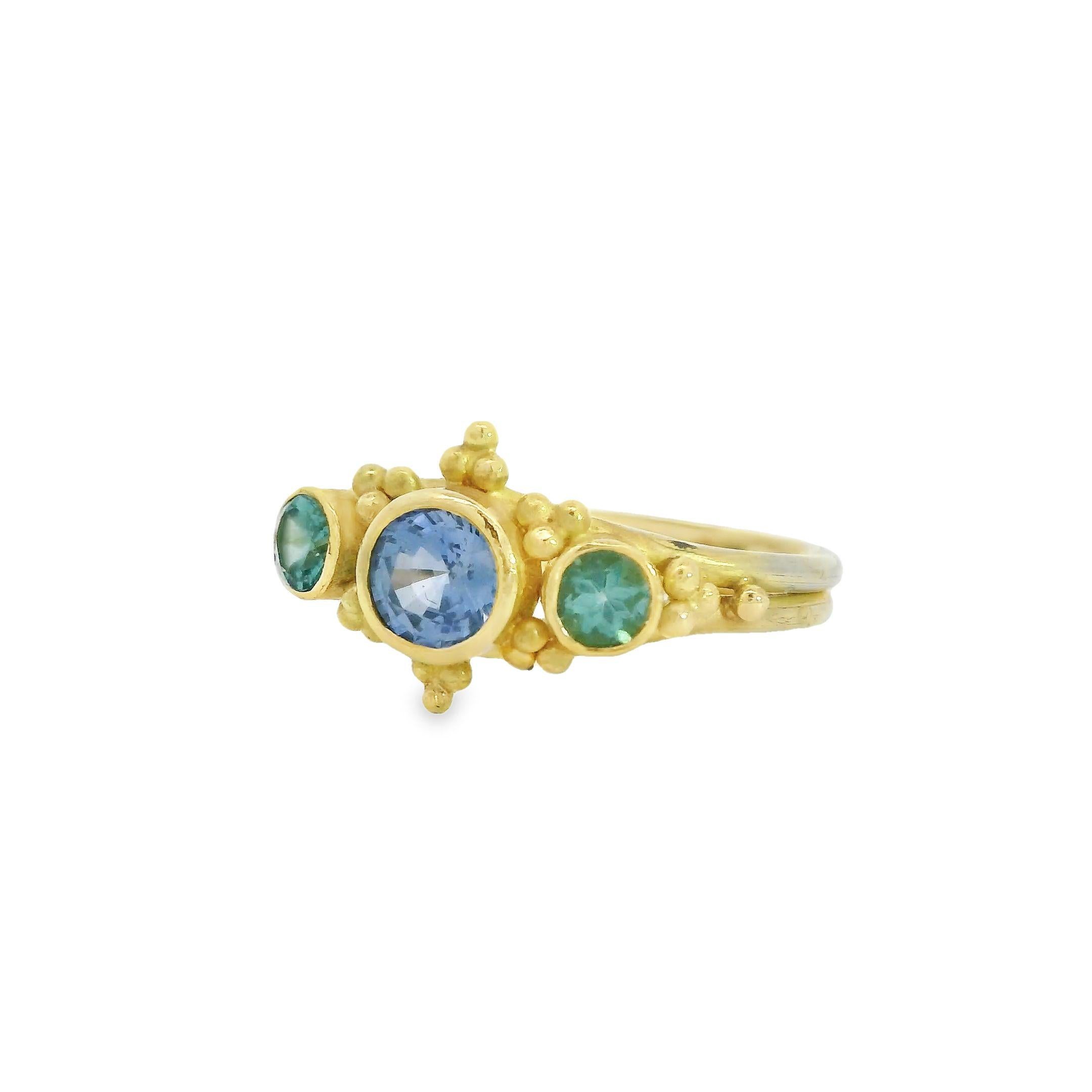 Experience the allure of this handcrafted Periwinkle Sapphire and Tiffany Blue Tourmaline 18k Ring, an exquisite work of art by Lynn Kathyrn Miller, the renowned artisan at Lynn K Designs. This ravishing piece of fine jewelry is a dedication to