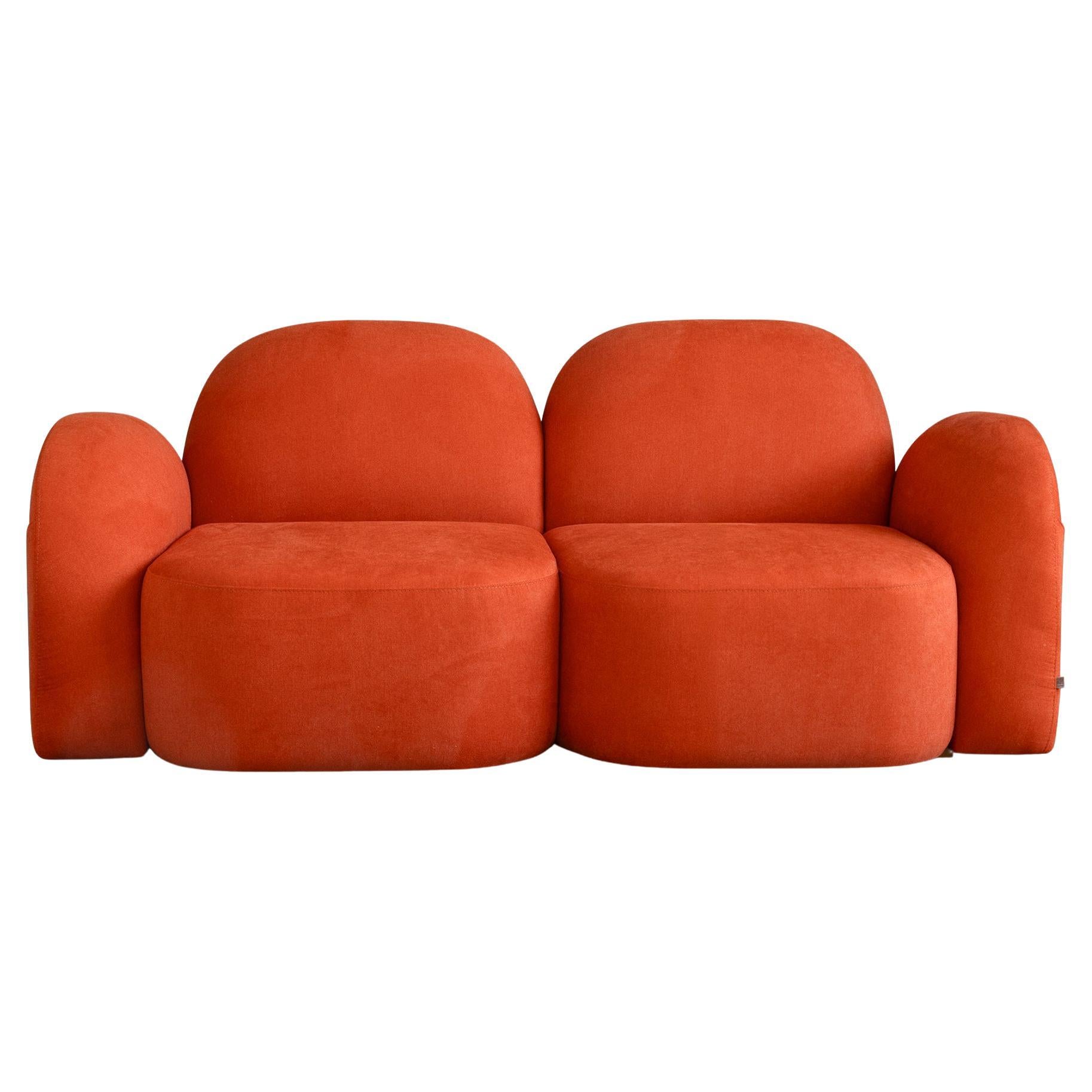 A fusion of comfort and quiet sophistication, the Perk Two-Seater Sofa by Lagu is designed to elevate both residential and professional interiors with its soft curves and smart features.

The organically shaped silhouette is complemented by plush