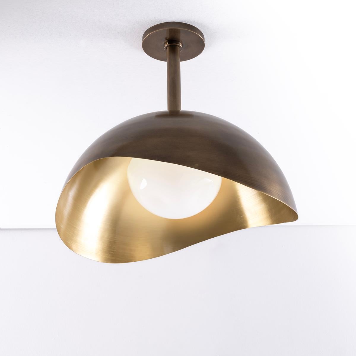 The Perla Grande features an organic brass or copper shell nestling our sfera glass handblown in Murano. Shown in three different finish combinations. Starting from $4,500.00. See our Perla flushmount and wall light for the smaller