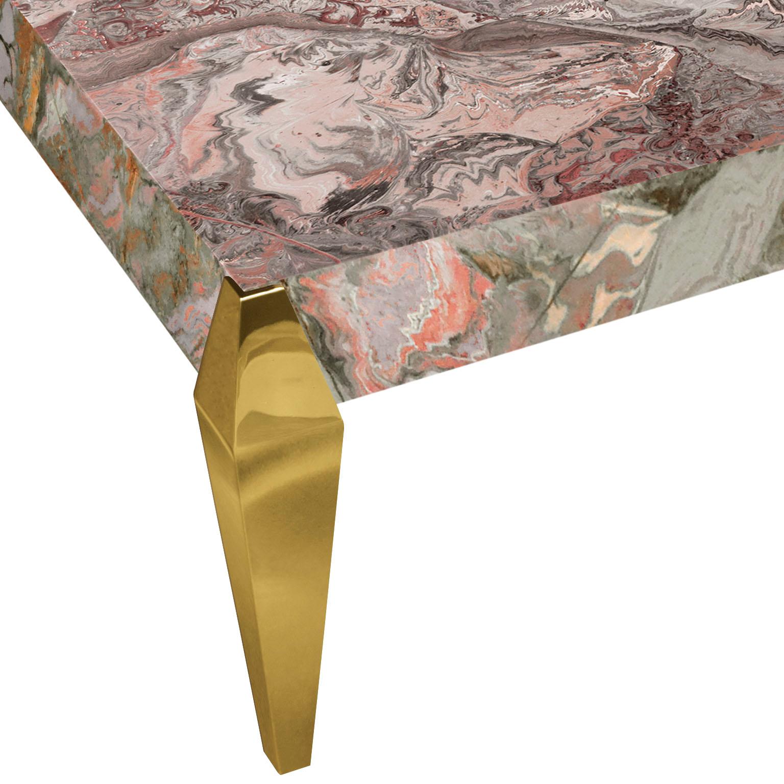 Perla H coffee table will add a final and sophisticated touch to your house.
This exquisite item is realized with a marbleized pearl grey scagliola top and matched to special gold leaf feet to make your room suggestive and classy according to your