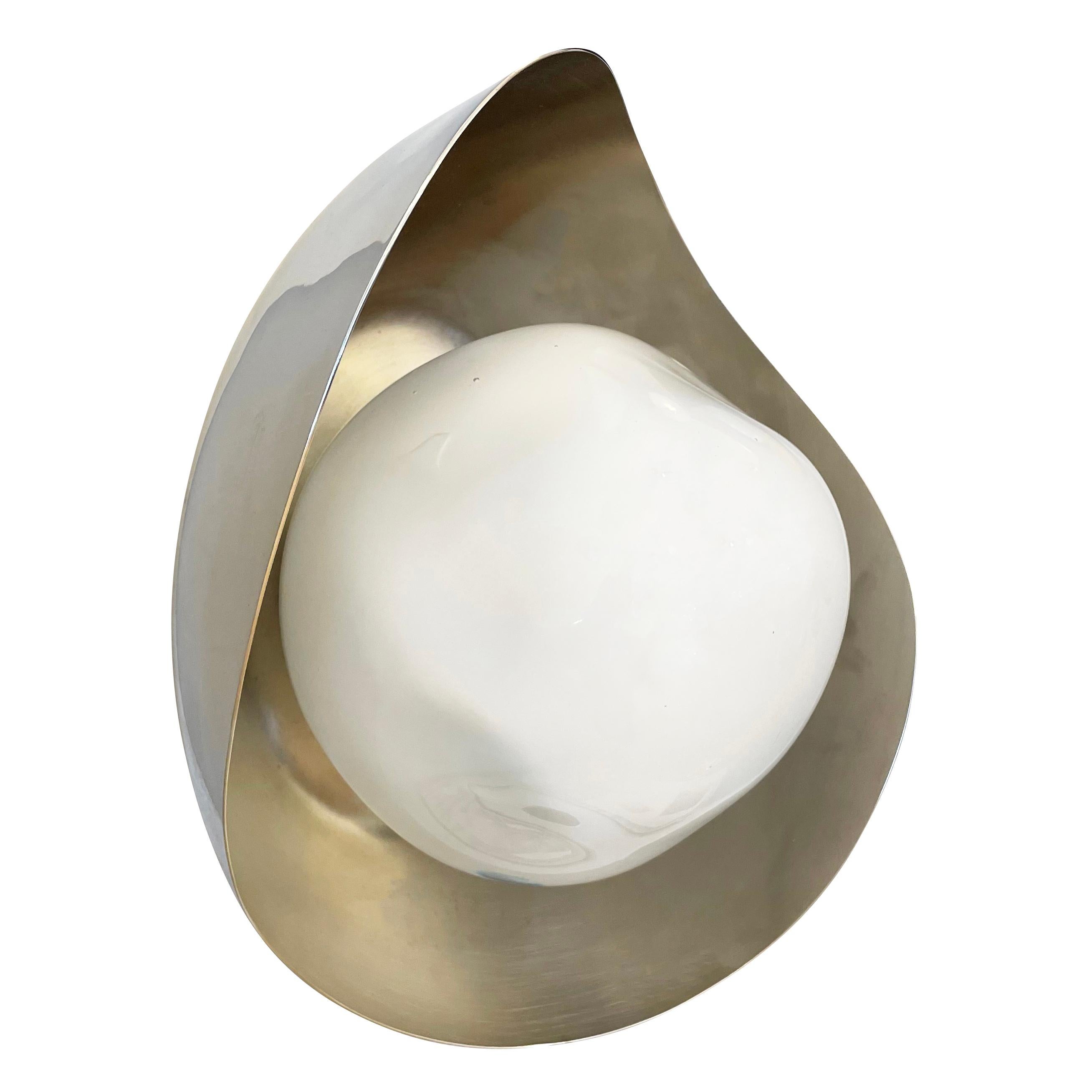 The Perla wall light features an organic brass shell nestling our sfera glass handblown in Tuscany. Shown in a two-tone finish with a polished nickel exterior and satin nickel interior. Can also be installed as a flush mount ceiling