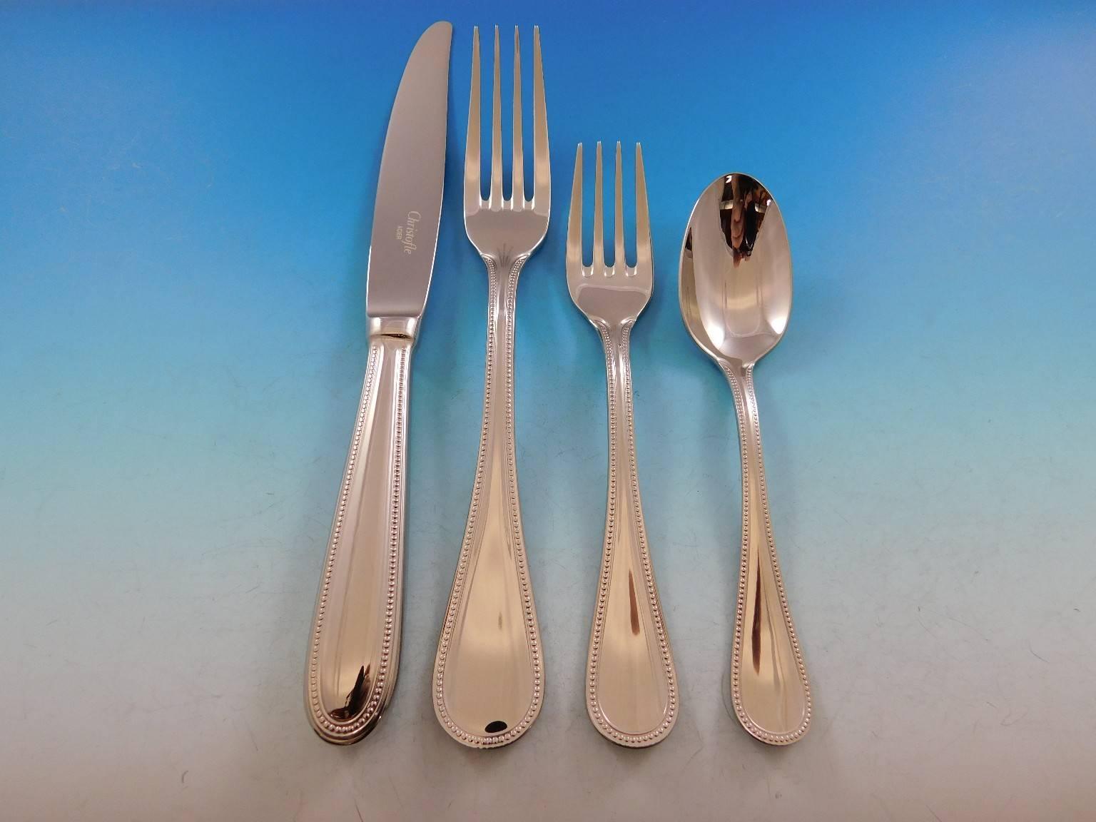 This New Perles by Christofle stainless steel flatware set includes:

12 dinner knives, 9 1/2