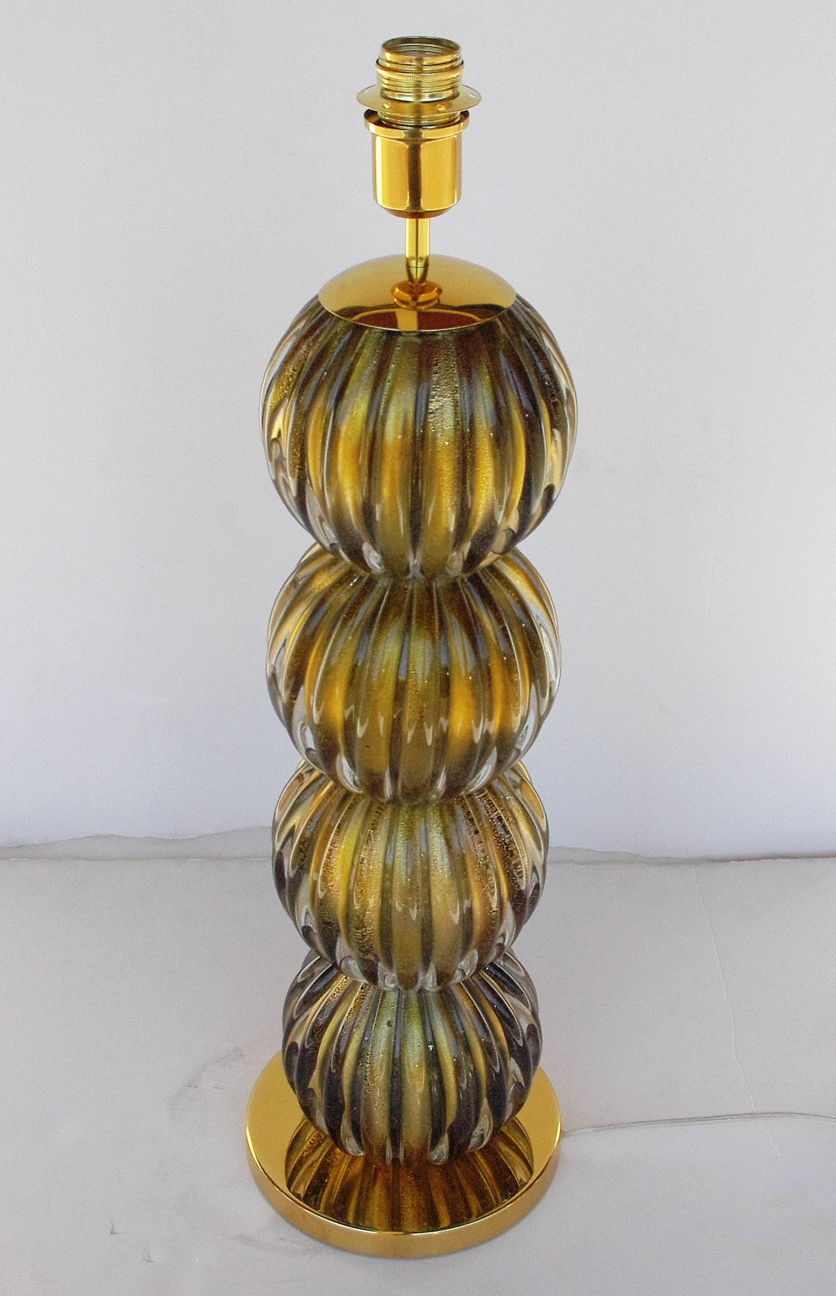 Italian table lamp with hand blown Murano glass infused with gold flecks and brass details / Designed by Fabio Bergomi for Fabio Ltd / Made in Italy
1 light / E26 or E27 type / max 60W 
Height: 28 inches / Diameter: 7.5 inches 
Order Only / This