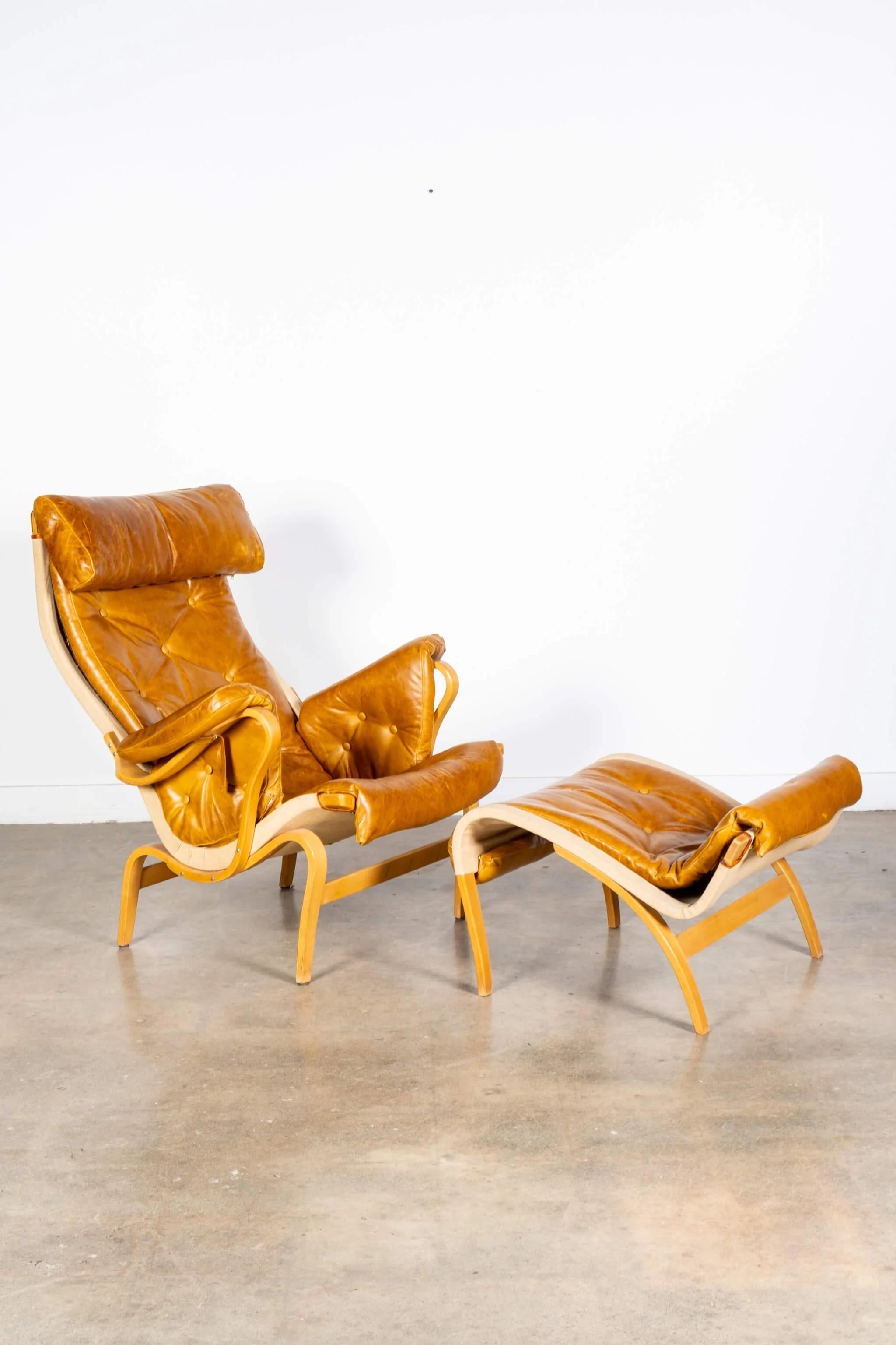 Mid-Century Modern 'Pernilla 69' Leather and Beech Chair and Ottoman by Bruno Mathsson for Dux For Sale