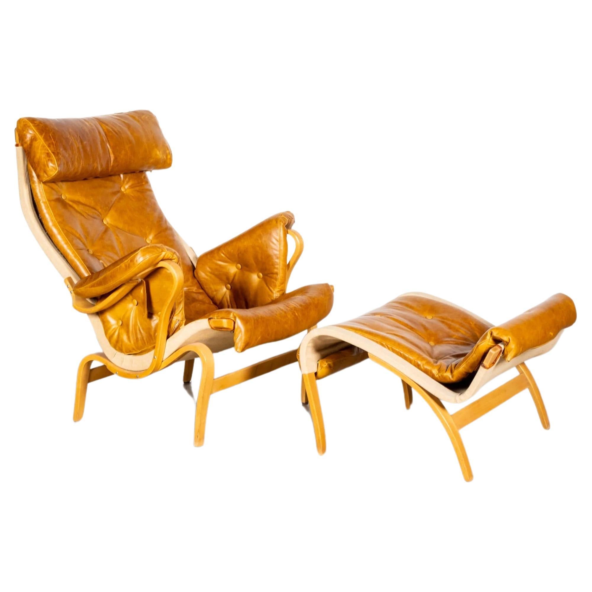 'Pernilla 69' Leather and Beech Chair and Ottoman by Bruno Mathsson for Dux For Sale