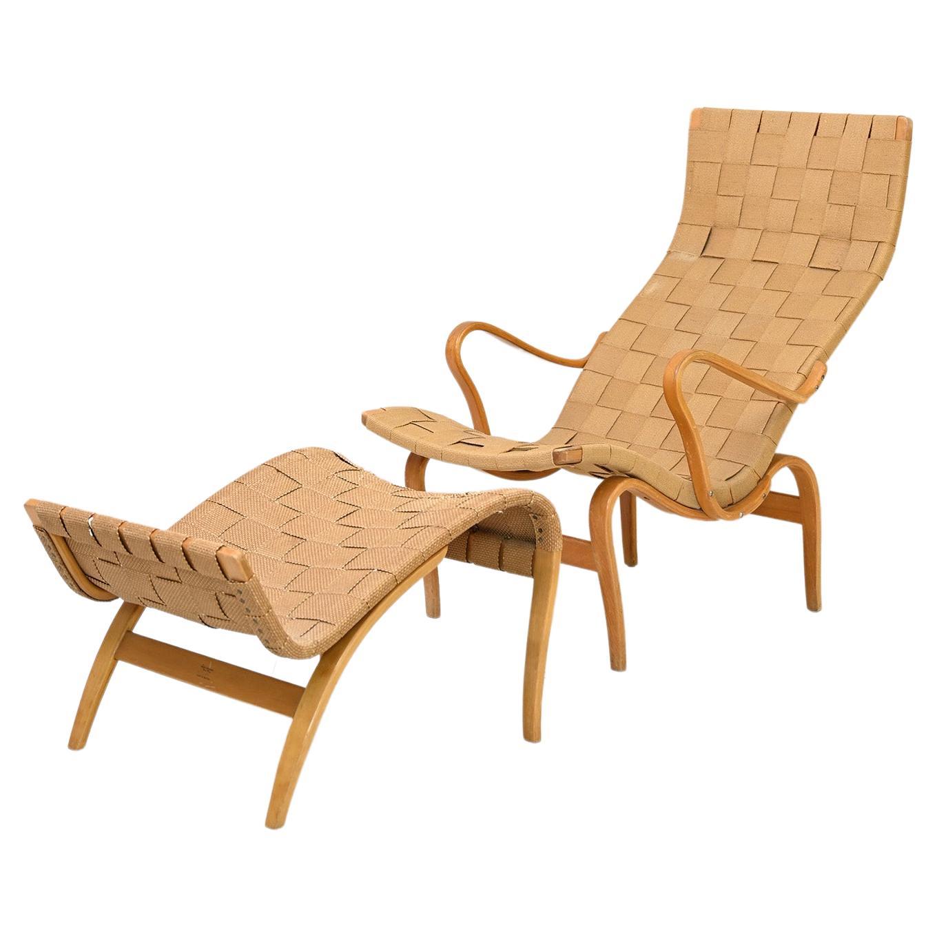 „Pernilla“ Sessel und Fußhocker entworfen von Bruno Mathsson