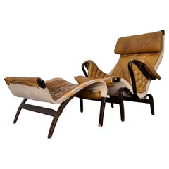 Retro Pernilla Leather Lounge Chair and foot stool by Bruno Mathsson for DUX