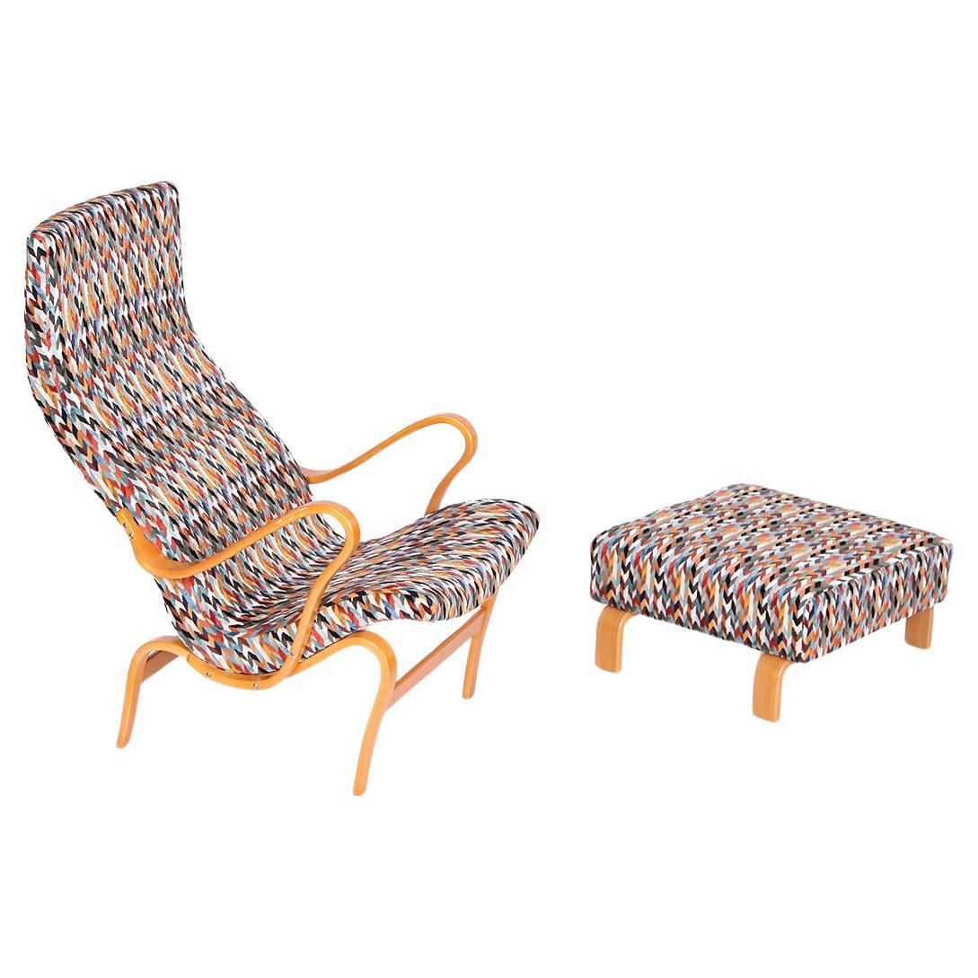 This design icon by Bruno Mathsson was produced in Sweden during the 1970s for Dux.
Completely restored and comfortable upholstered. The wooden frame was repainted.
Covered with a fabric by Osborne &  Little. 
The frame is stamped with the maker’s