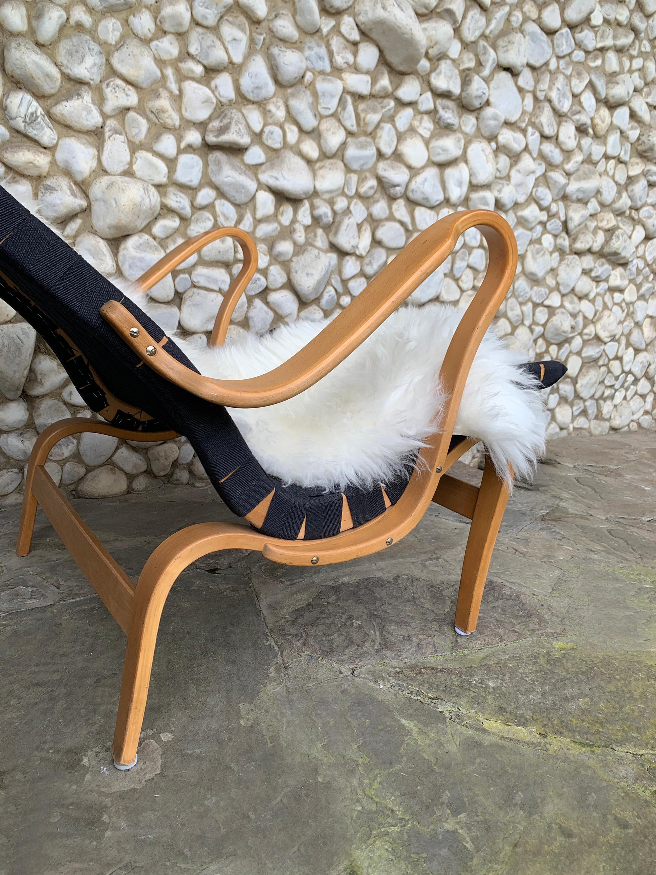 Sheepskin Pernilla Lounge Arm Chair in beech & black canvas by Bruno Mathsson, Sweden 1970 For Sale