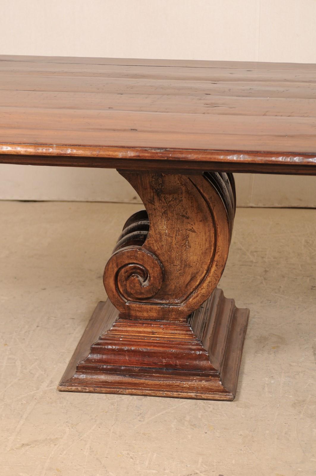A Peroba Wood Dining or Conference Table w/ Fabulously Thick Carved Scroll Bases In Good Condition For Sale In Atlanta, GA