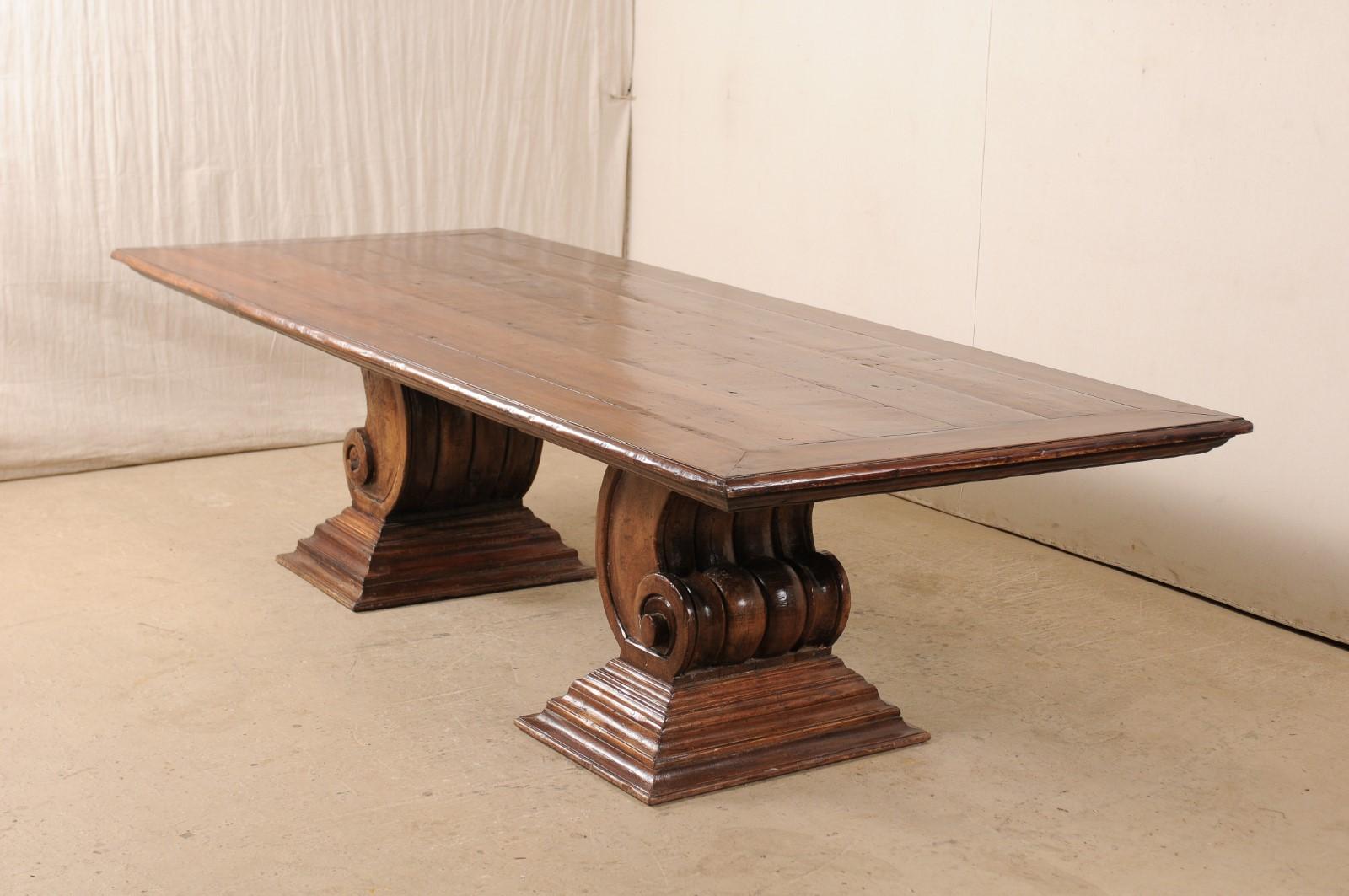 20th Century A Peroba Wood Dining or Conference Table w/ Fabulously Thick Carved Scroll Bases For Sale