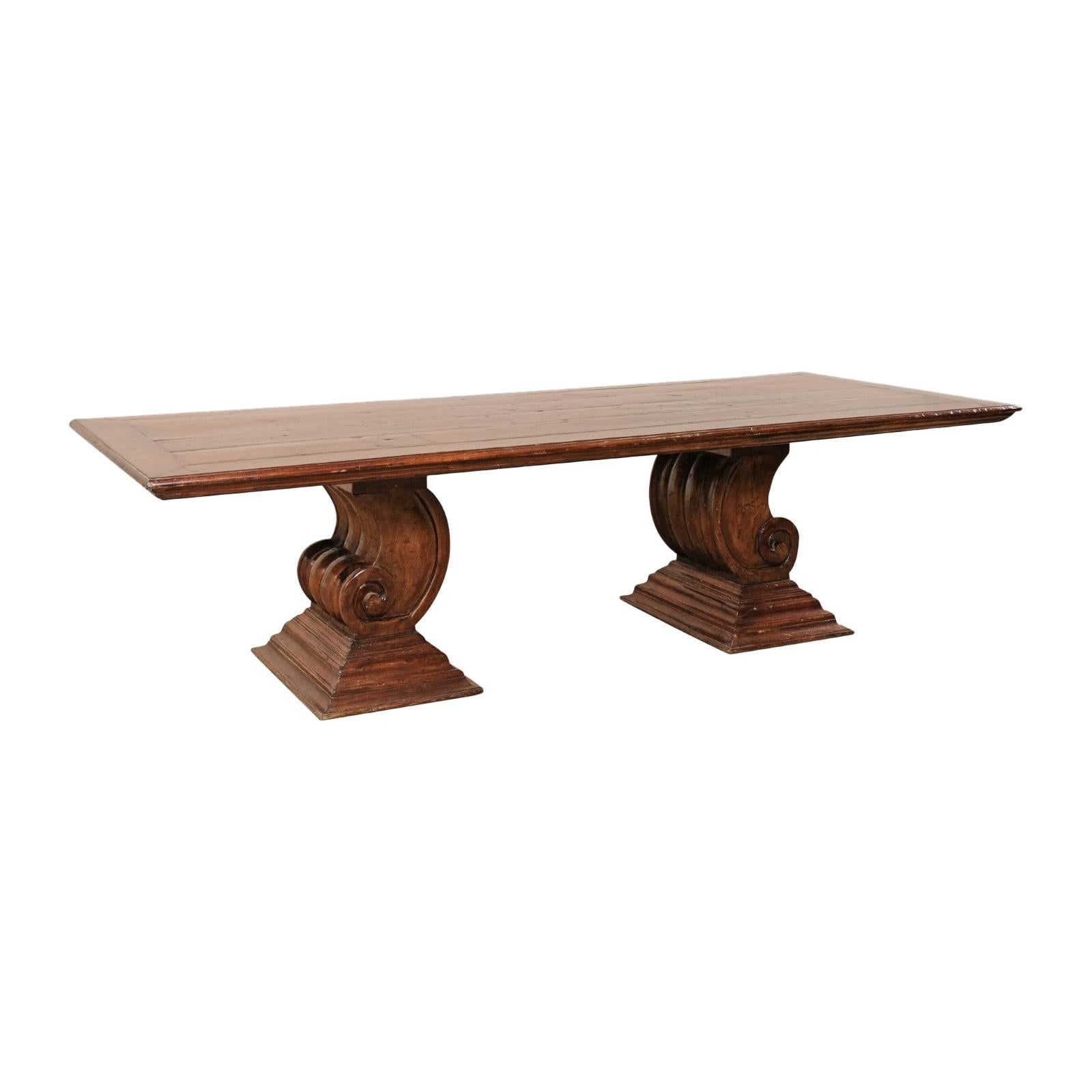A Peroba Wood Dining or Conference Table w/ Fabulously Thick Carved Scroll Bases For Sale