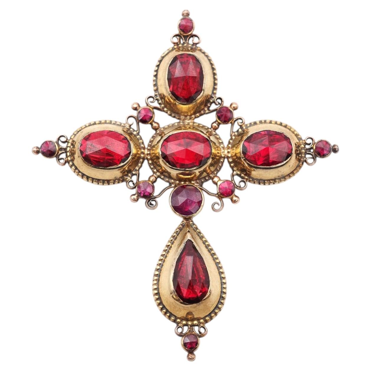 Perpignan garnet cross pendant in 18 karat gold