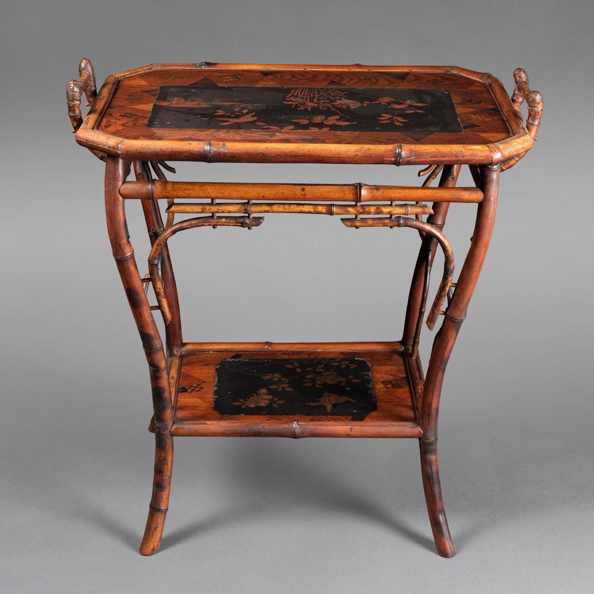 Perret et Vibert bamboo side table. The two trays in bamboo veneer with a black lacquered center. France, circa 1880.