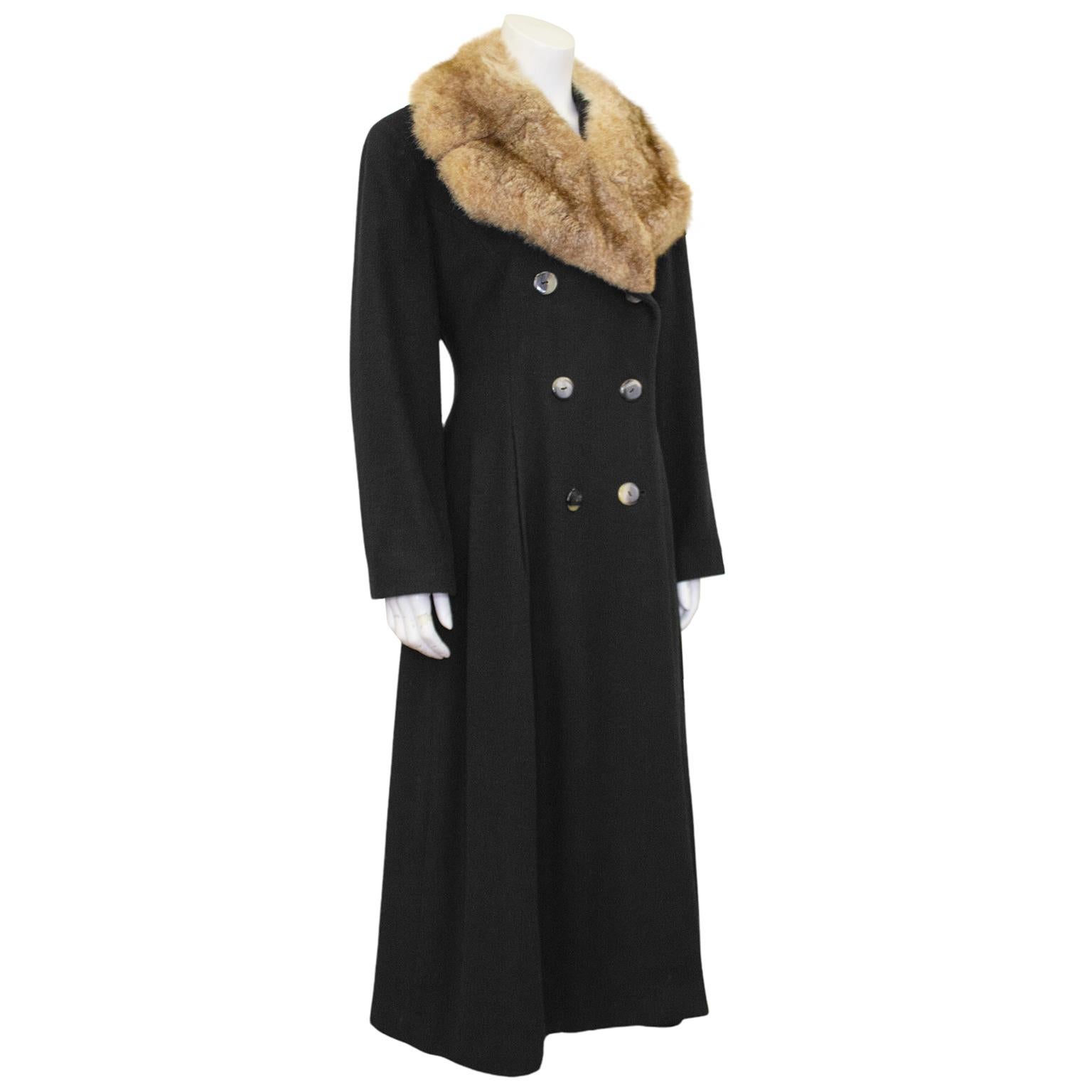 Perry Ellis princess style black wool maxi coat with fur collar from the 1980's, the height of his too short career. Fitted through the waist, double breasted faux tortoise button closure, sweeping fullness to the skirt, and a half belt at the back