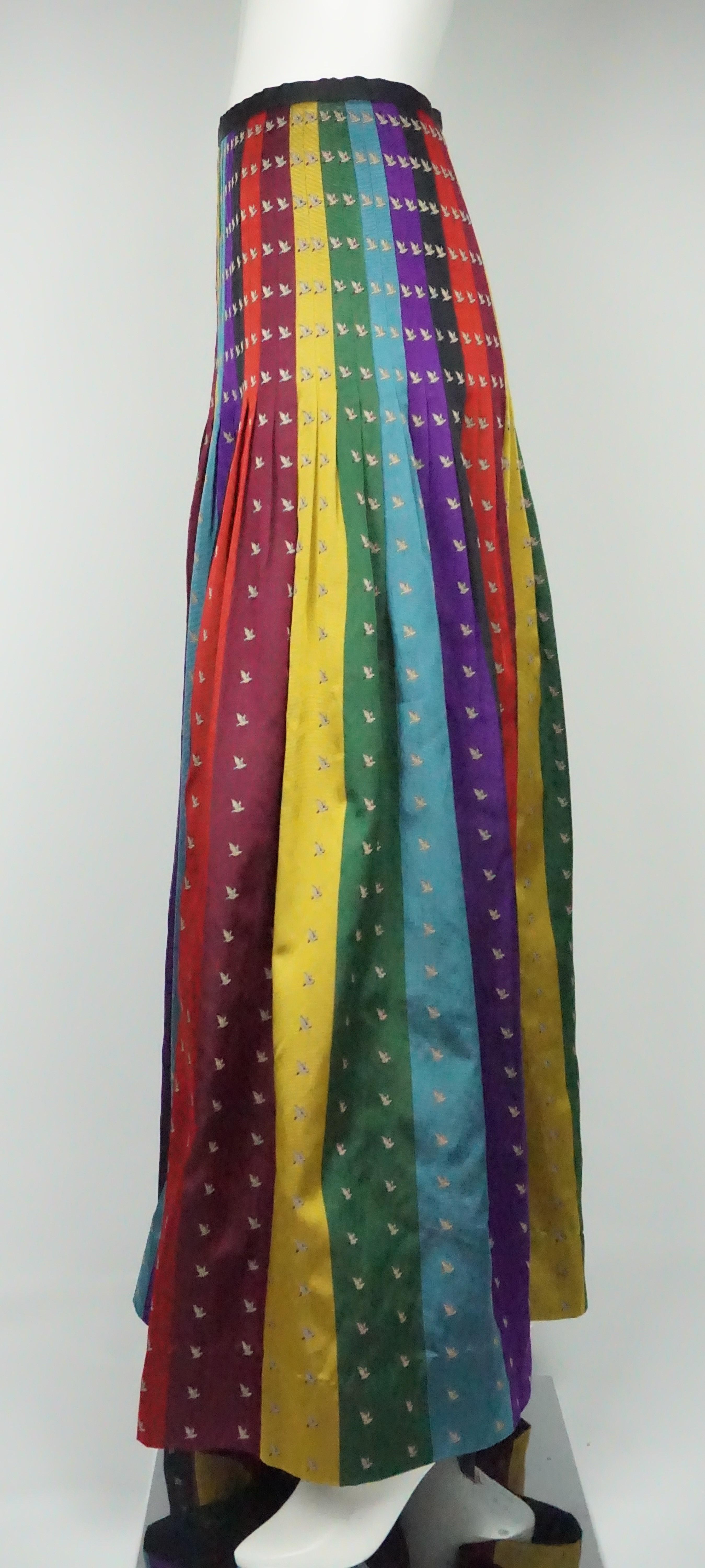 Perry Ellis Multicolor Silk Pleated Skirt - 8  This gorgeous and unique skirt is in excellent condition. The skirt is completely made of silk and has small geese on the fabric and is show throughout the entire skirt. There are red, purple, yellow,