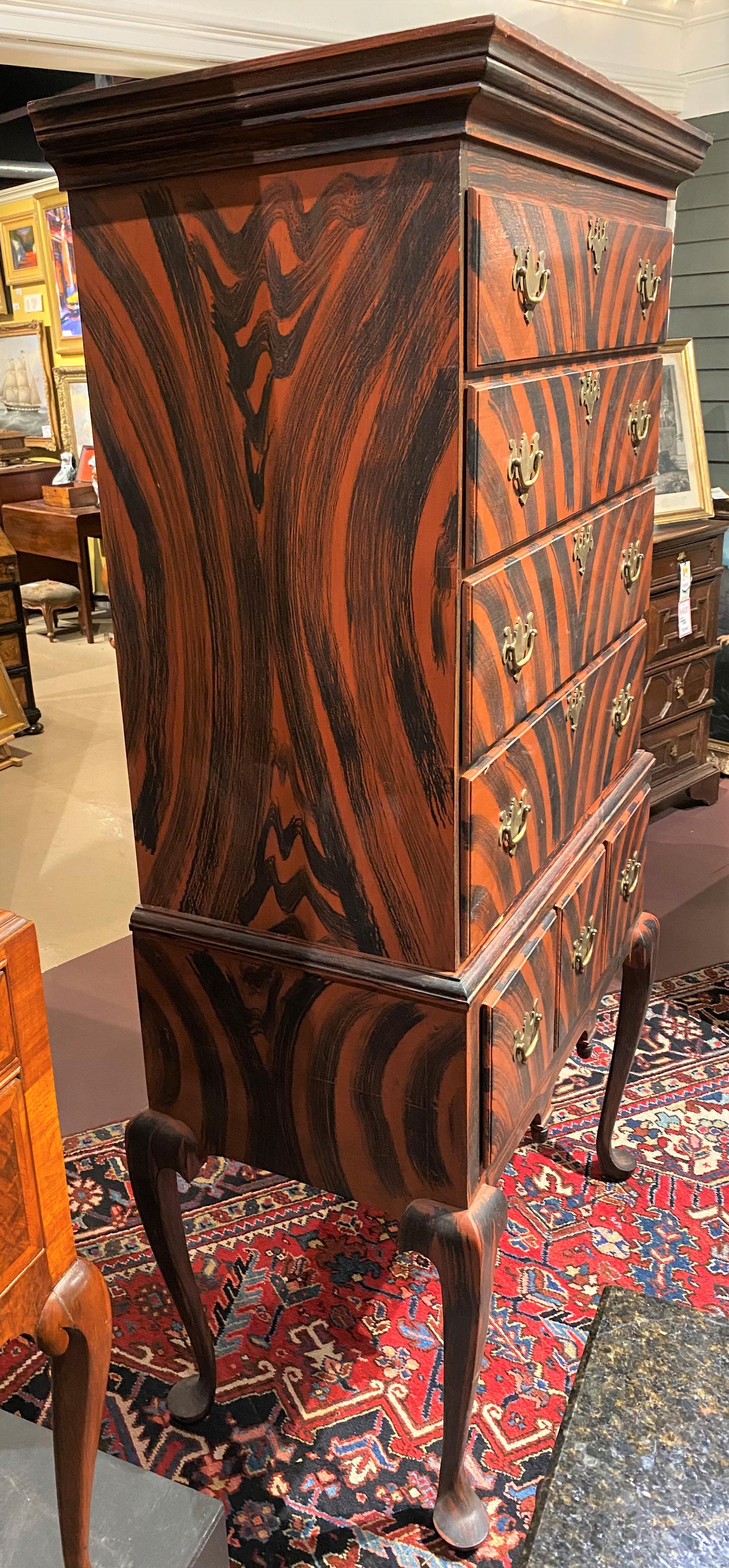 A fabulous grain painted highboy in the 18th century manner by Maine craftsman Perry Hopf, son of Claudia & Carroll Hopf, master painters from Kennebunk, Maine, well known for their scissor cuttings, painted frames, and wooden-wares. This boldly