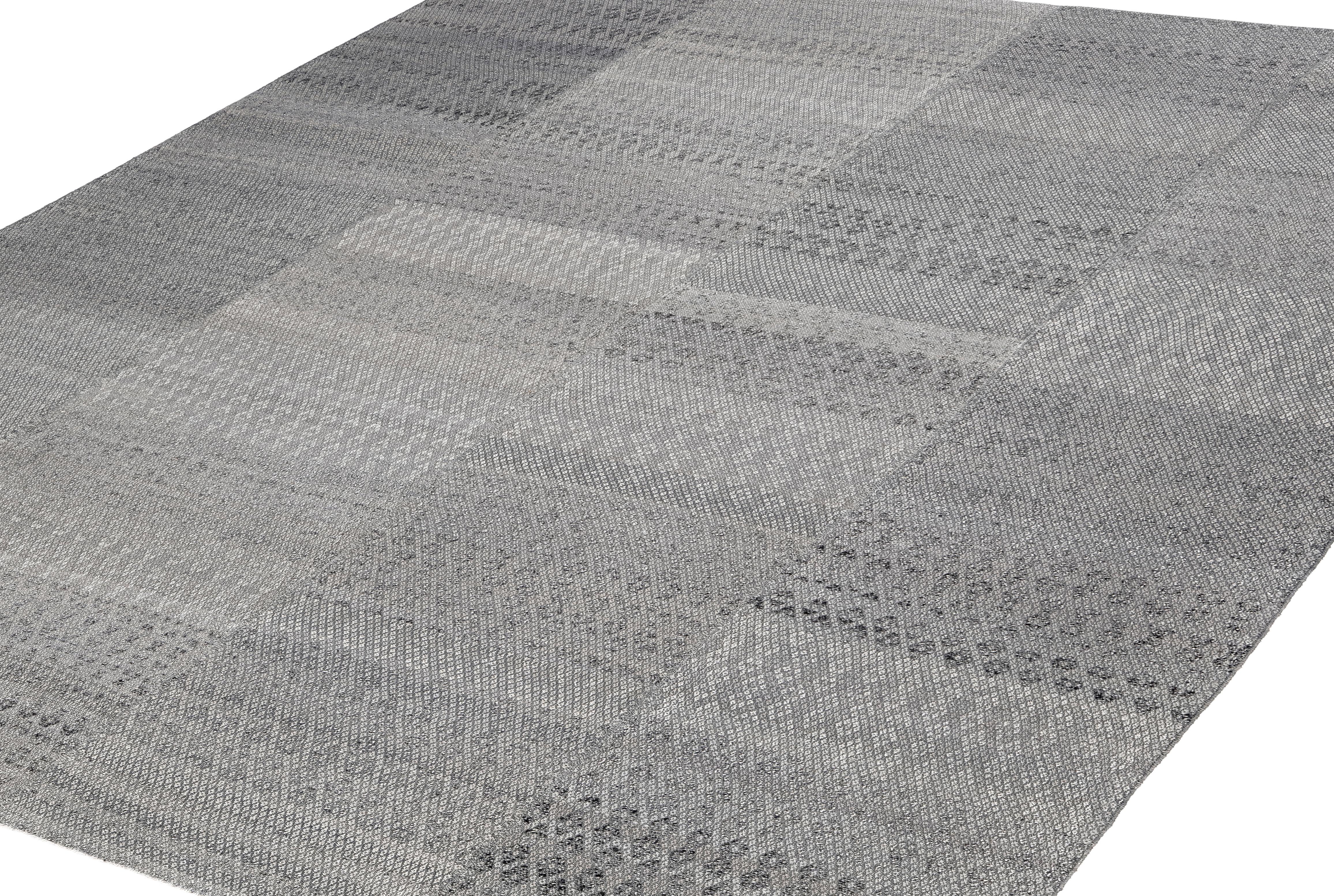 This Damavand flatweave rug is an exceptional handwoven piece crafted in Iran using a sophisticated blend of hand-spun wool and natural cotton, all dyed with fully organic, plant-based pigments. Inspired by antique Kurdish kilims, its design