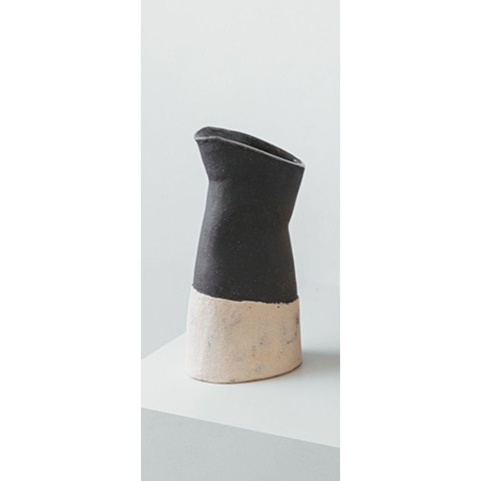Perséfone Wine Jar by Cuit Studio
One of a Kind.
Dimensions: D 8 x W 12 x H 24 cm.
Materials: Natural and black stoneware.

Mix of natural and black stoneware, glazed inside with transparent color. Water & food safe. Handmade in Barcelona. Also