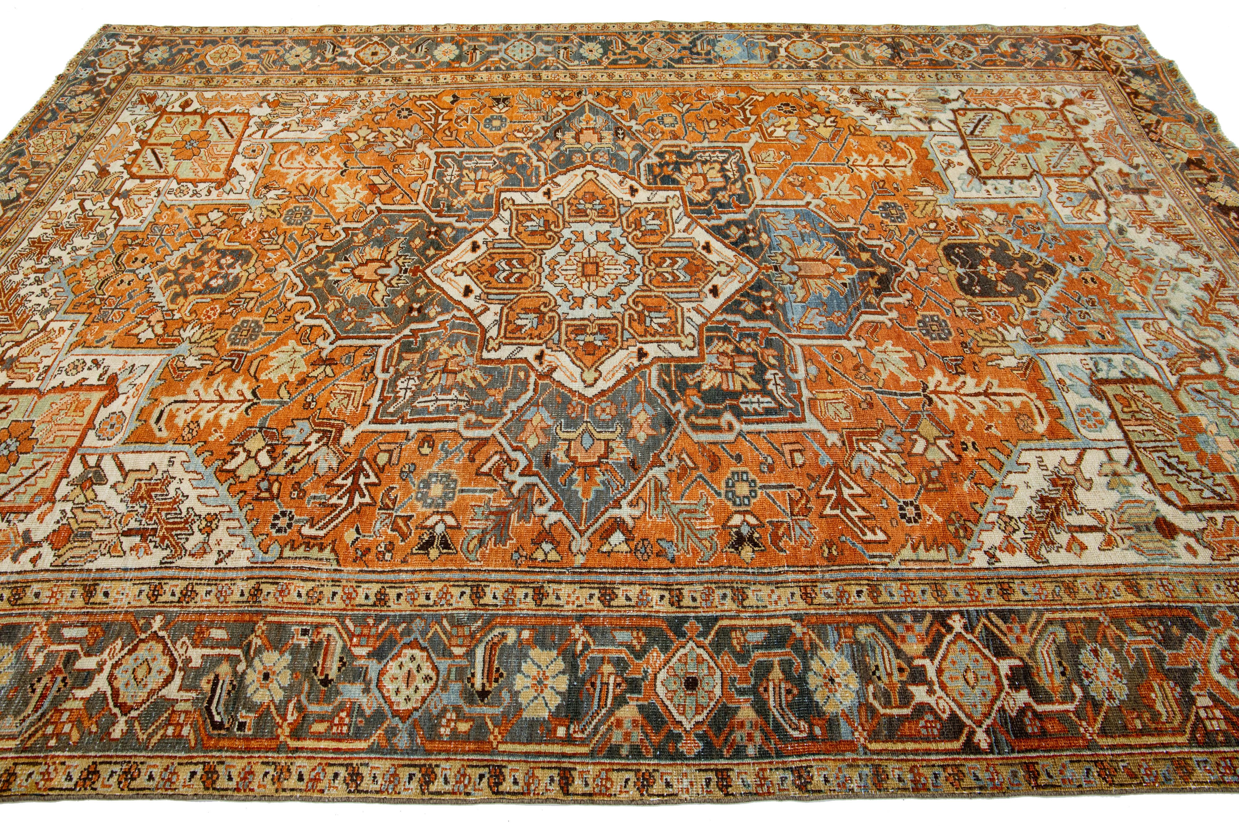 Hand-Knotted Persian 1910s Antique Heriz Medallion Wool Rug With Orange-Rust Color Design For Sale