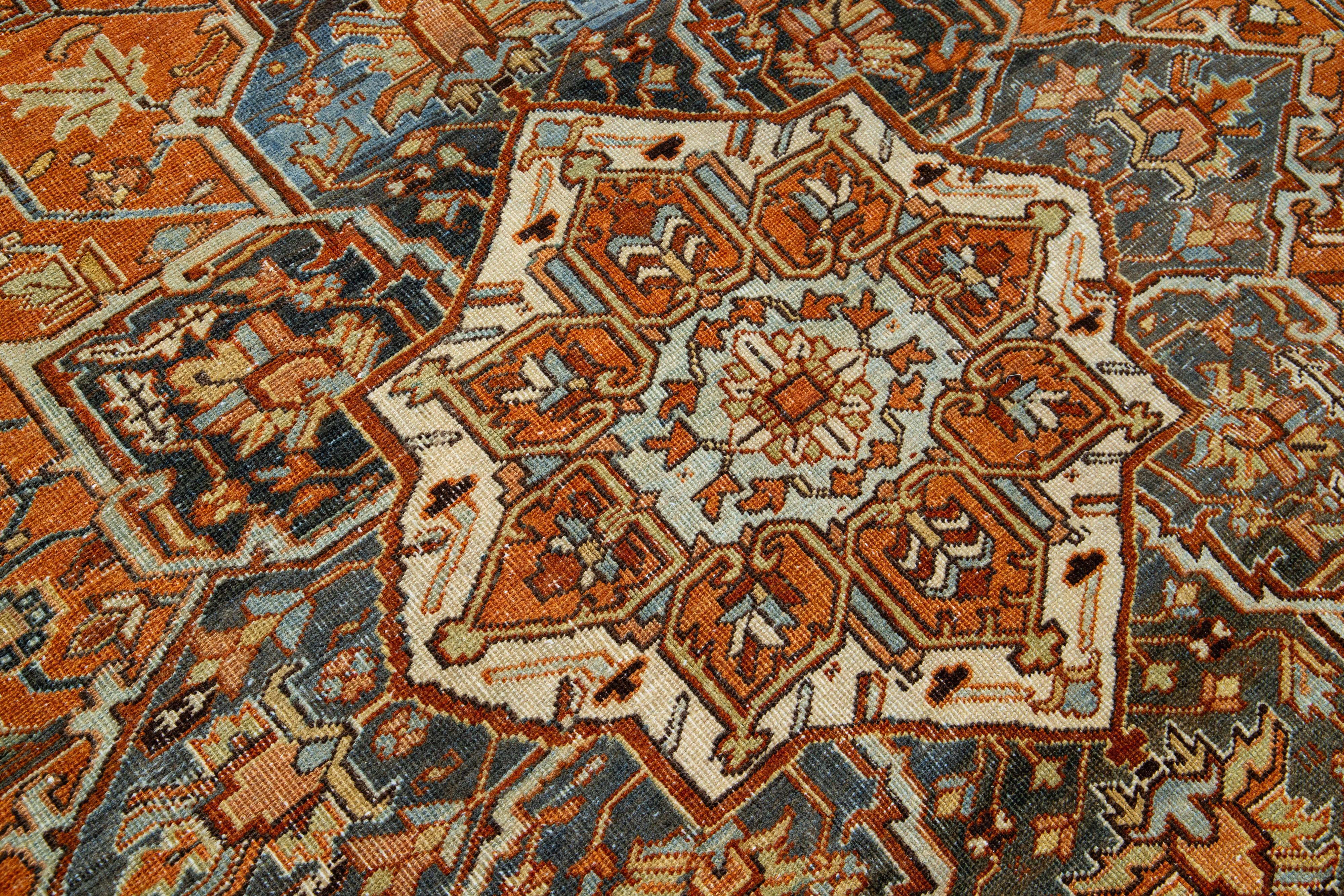 Early 20th Century Persian 1910s Antique Heriz Medallion Wool Rug With Orange-Rust Color Design For Sale
