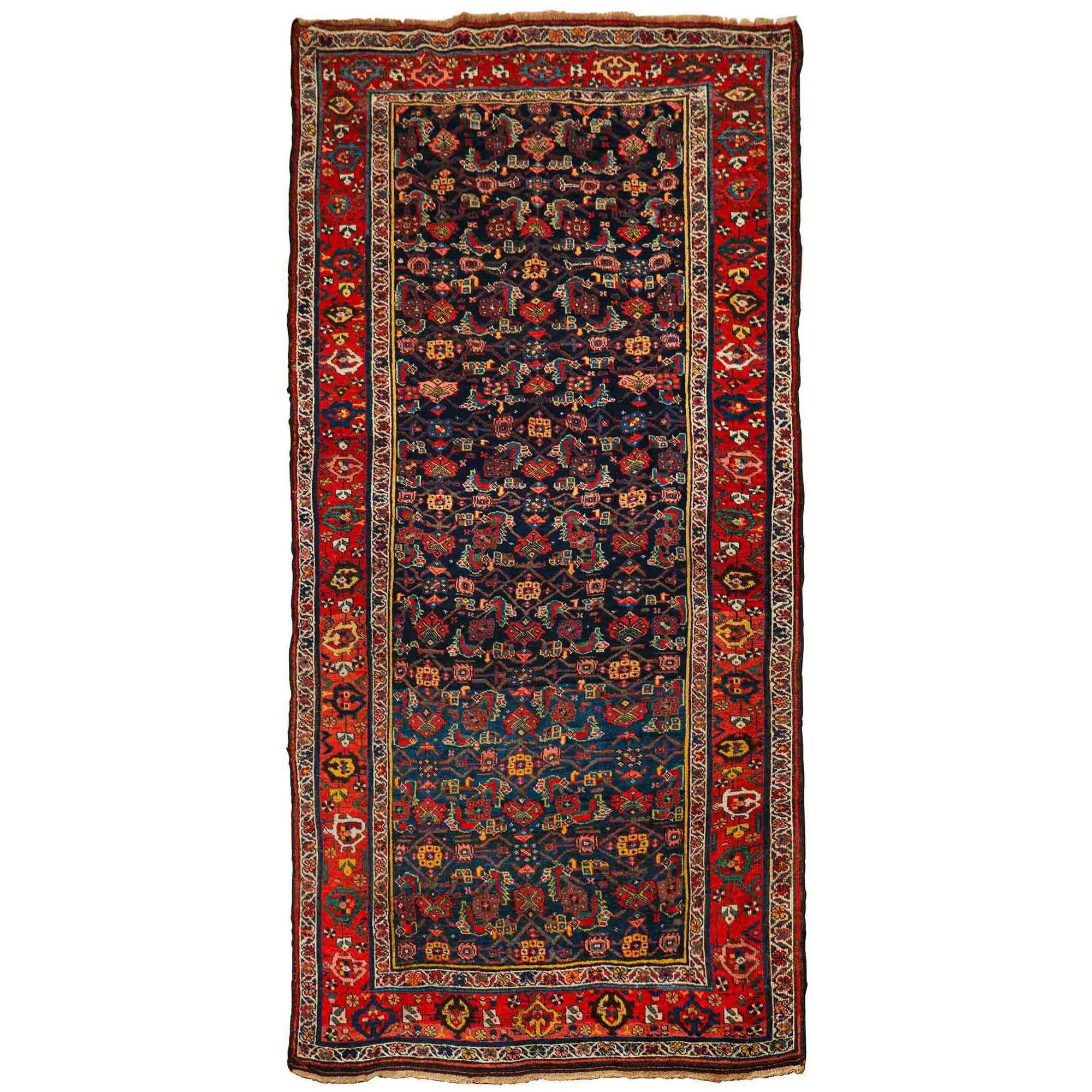 PERSIAN ANTIQUE BIJAR (BIDJAR) RUNNER RUG
Western Persia, circa 1920
Item # 404KJT12P

A rich and timeless Persian Bijar runner rug, this carpet features a chaotic ground spilling over with densely packed motifs that move and shift from one form