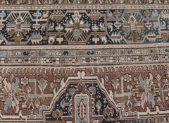 Persian Antique Heriz Rug with Geometric Design in Blue's, Tan, Cream, and Brown