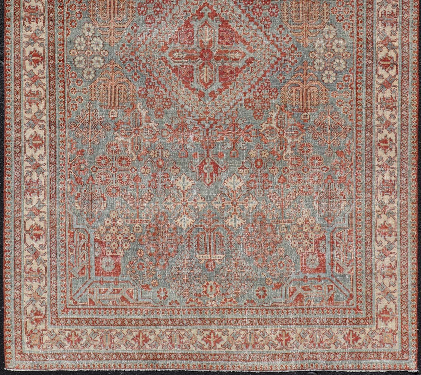 20th Century Persian Antique Joshegan Rug with Geometric Medallion Design in Soft Red's For Sale
