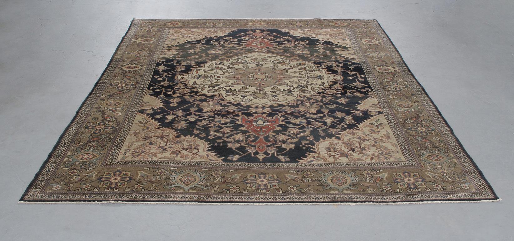 Circa 1900, this Antique Malayer hand-knotted rug comes from the town of the same name. This area in Iran has a rich weaving culture dating back over a century with individual weavers crafting some of the finest hand-carded wool rugs made with