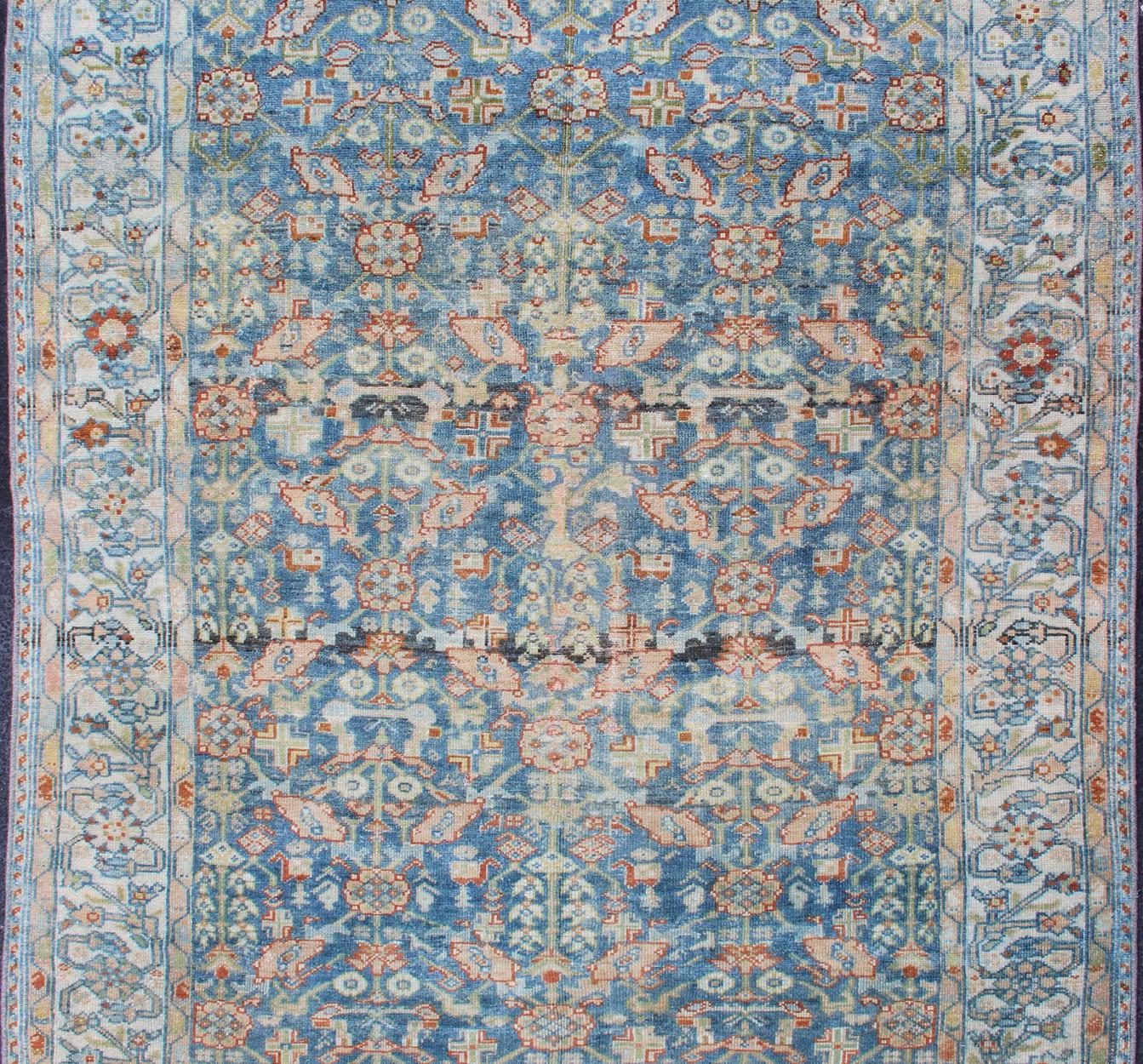 Antique Persian rug with blue field and ivory border, rug SUS-2007-465, country of origin / type: Iran / Malayer, circa 1920.

This traditional Persian Malayer carpet from the early 20th century is characterized by a central field filled with