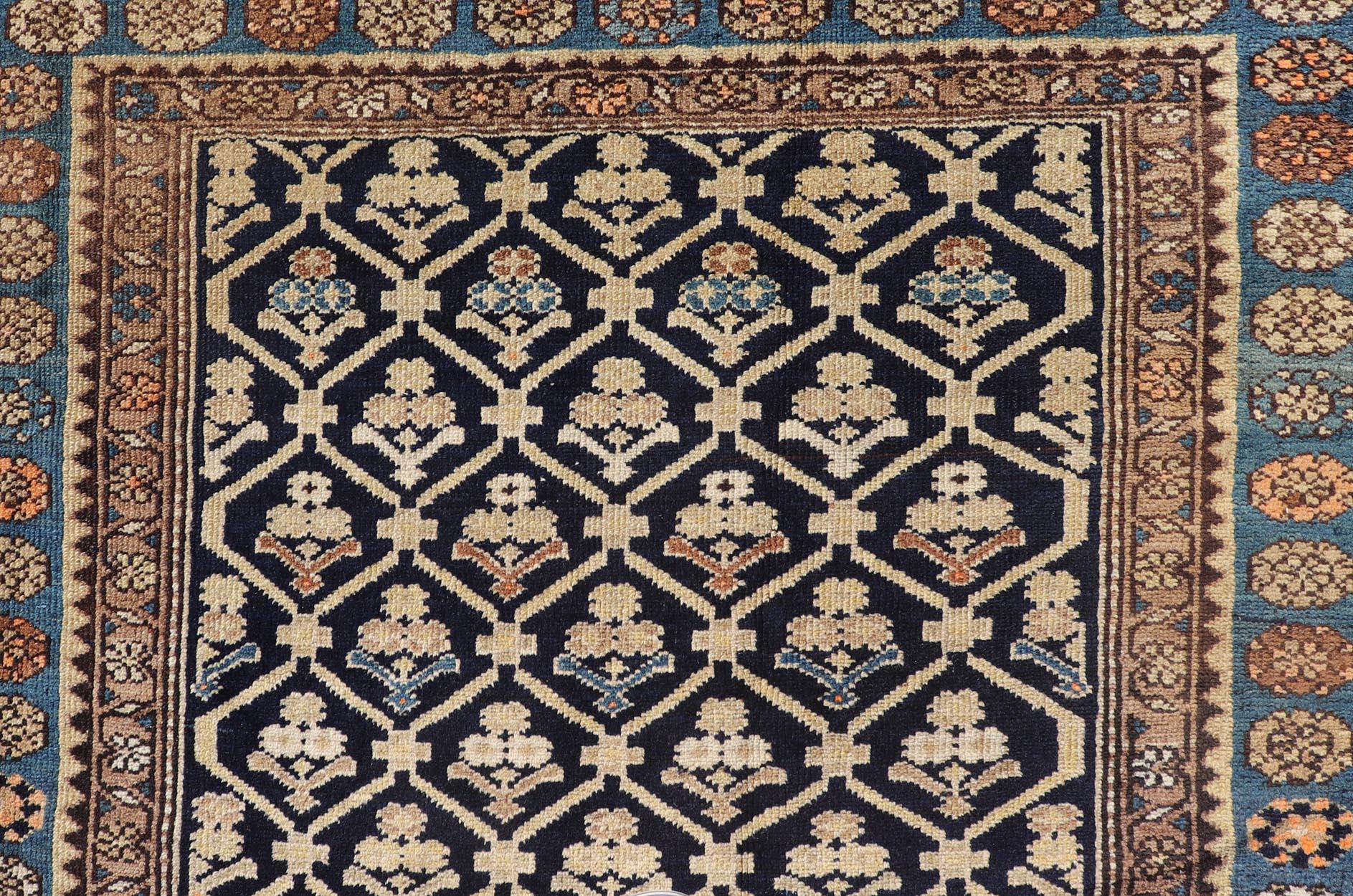 Blue, dark blue, orange, and tan Malayer antique rug Persian, Keivan Woven Arts / rug EMB-9710-P13897, country of origin / type: Iran / Malayer, circa 1920.

Measures: 3'9 x 5'4.