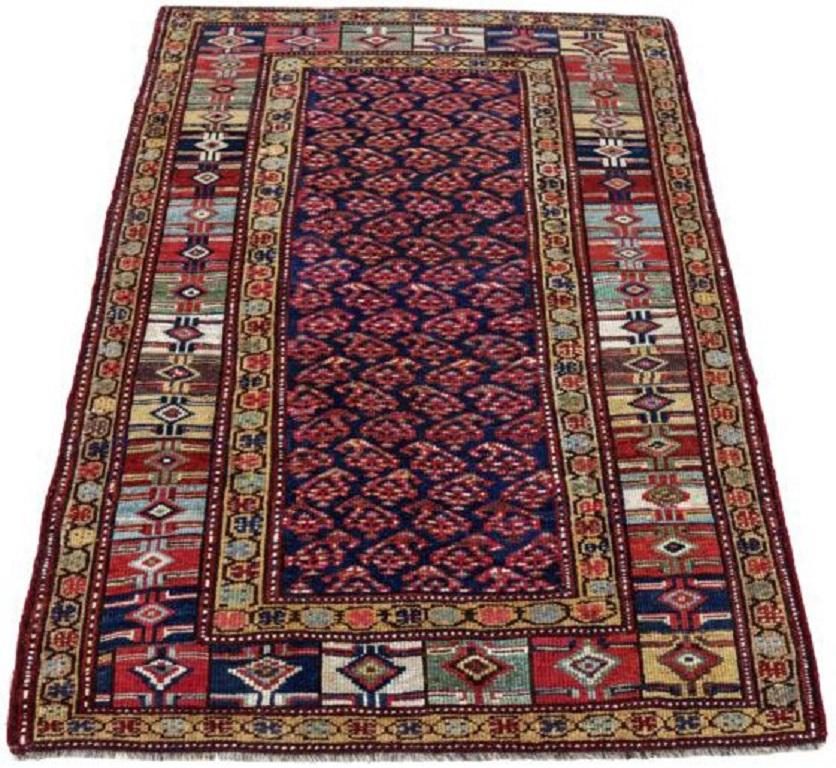 Discover the elegance of Persian Azerbaijan featuring Small Rug in Circa 1880. Designed with Wool and GreenNavy BlueRedYellow, this exclusive design is perfect for enhancing your space.