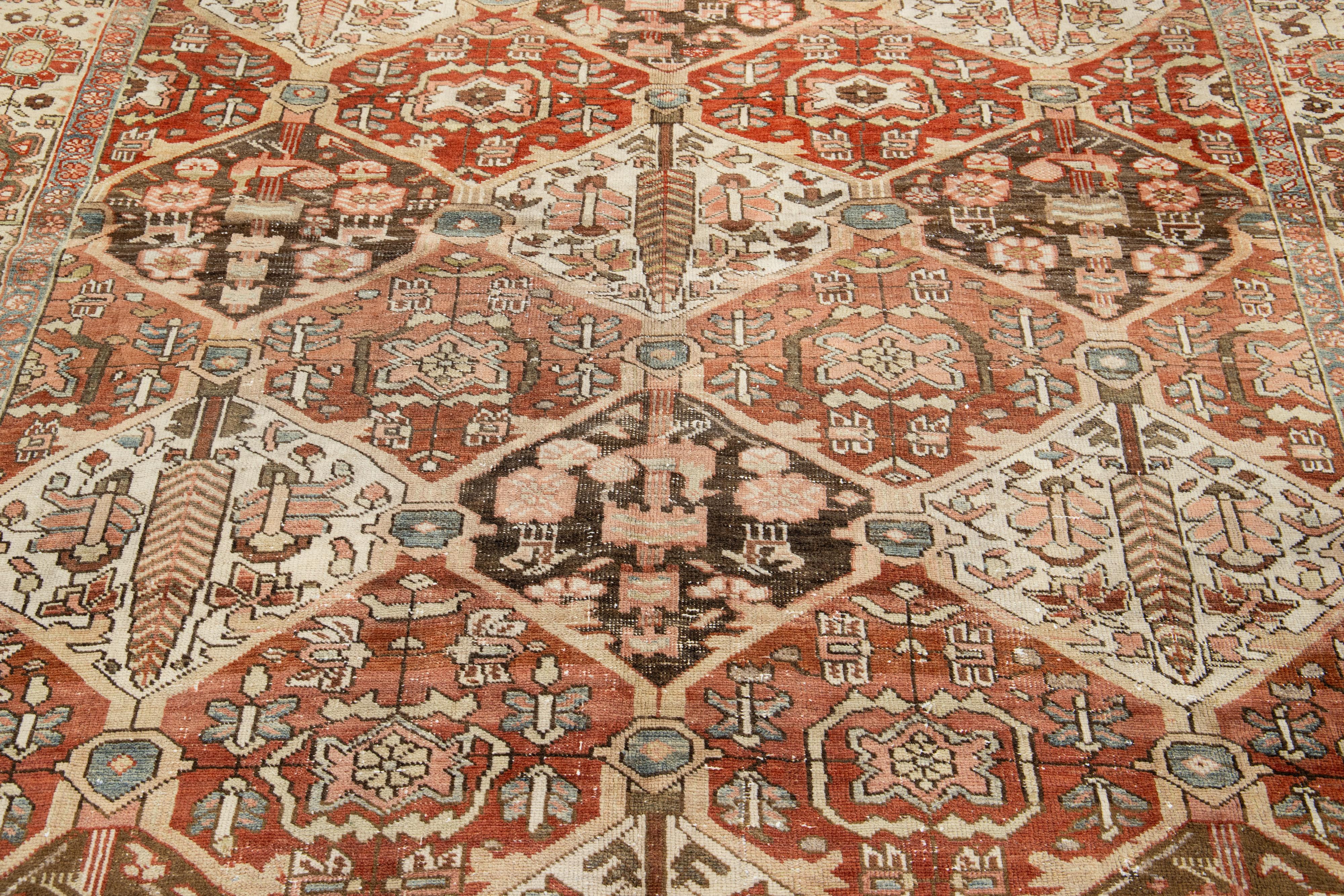 20th Century Persian Bakhtiari Rust Wool Rug with Allover Floral Pattern From The 1910s For Sale