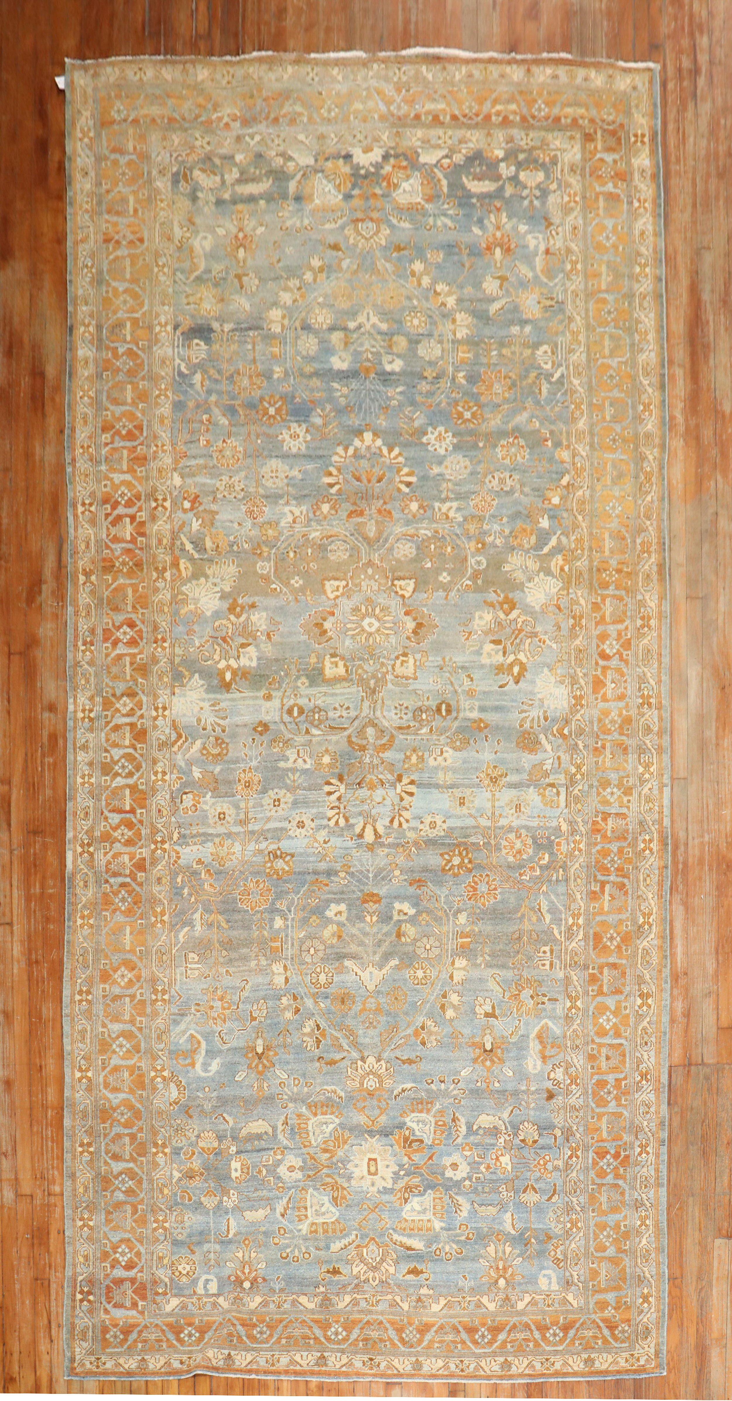Early 20th century Persian Bibikabad rug with brown and apricot accents on a grayish-blue ground

Measures: 7'1'' x 16'

Bibikabad rugs come from the Hamadan village region of western Iran. Meaning 