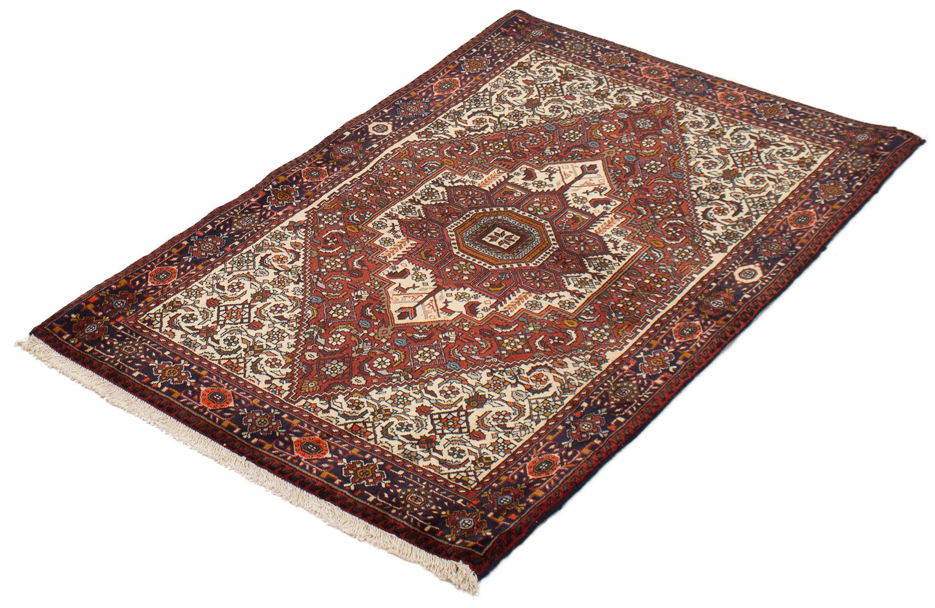 This vintage Wool Persian Bidgeneh rug measures 3'3 x 5'0 and was handwoven in the 1980s. It features vegetable-dyed hues of red, black and gray along with a floral medallion in the center. This is a rug that is in good vintage condition.
Orley