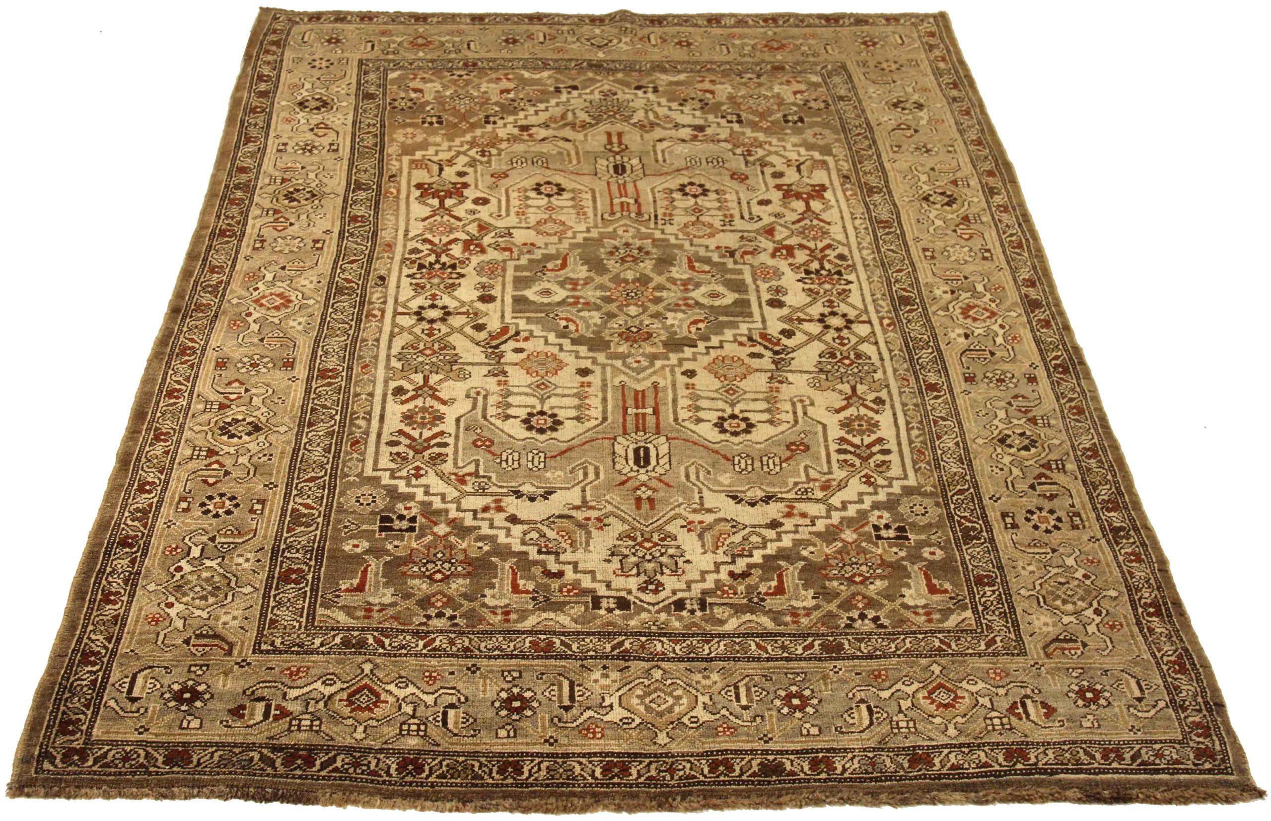 Discover the elegance of Persian Bijar featuring Small Rug in Circa 1910. Designed with Wool and BrownIvoryRedTaupe, this exclusive design is perfect for enhancing your space.