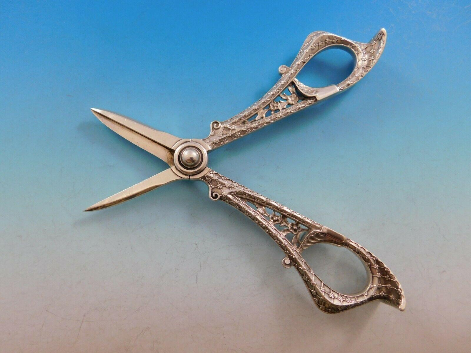 Persian originated in 1872 when exotic lands were in vogue (Japanese, Egyptian, Persian). It is absolutely striking with its intricate design. It is a beautiful example of the silver makers art.

Stunning sterling silver Grape Shears measuring 6