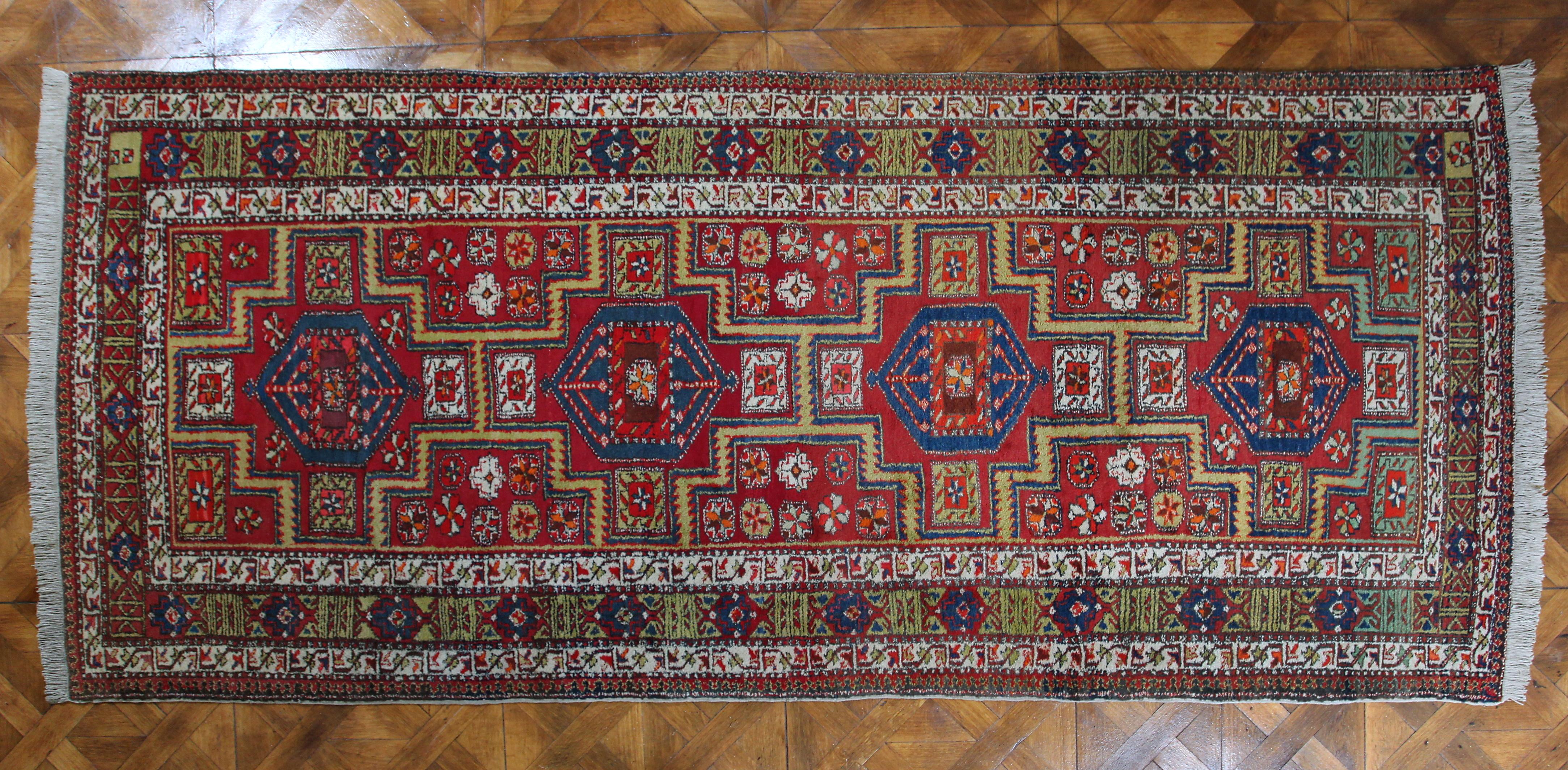 Persian carpet Beluch 372 X 161 cm

A hand-knotted Persian rug from the border region with Afghanistan. Wool pile on cotton warp. Binding density around 90,000 knots per m2. This type of carpet is very durable and is also suitable for places with a