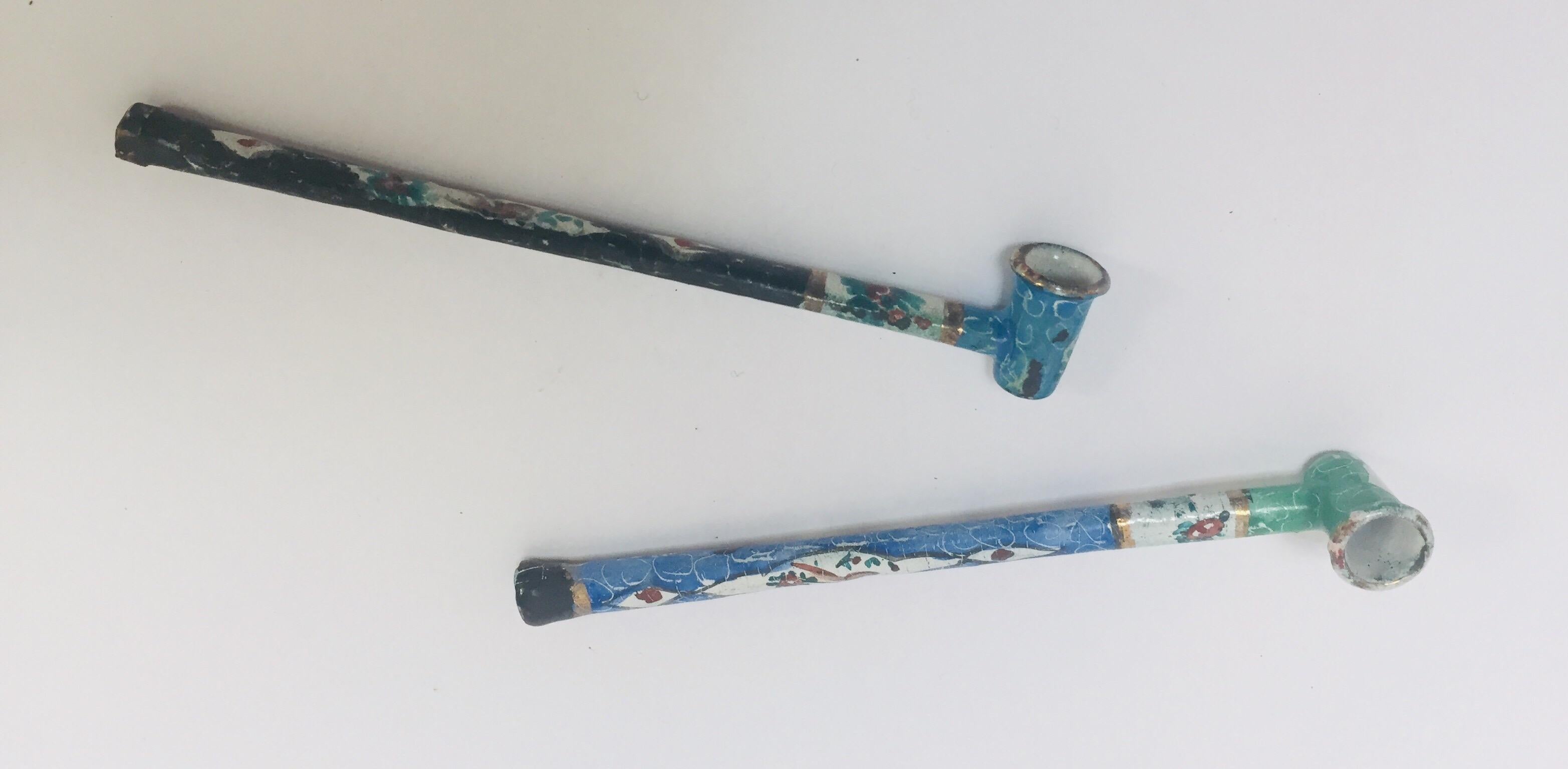Two hand painted Persian decorative opium metal enameled pipes.
 