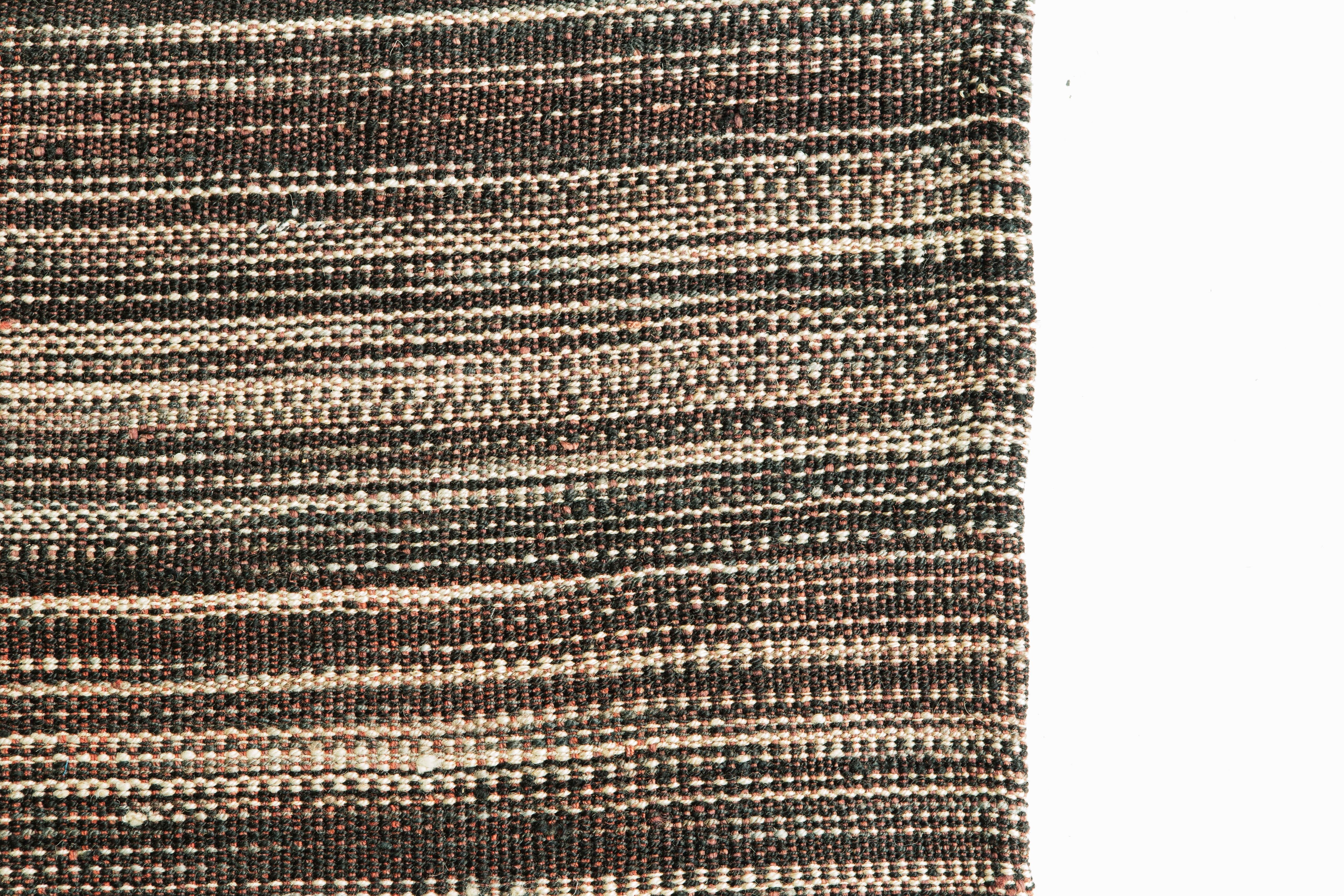 Live life in style with the Kilim flat-weave rug in dark brown and neutral colors. It is simple yet accommodating, making it an excellent rug for any design space.

Rug number: 26247
Size: 8' 5